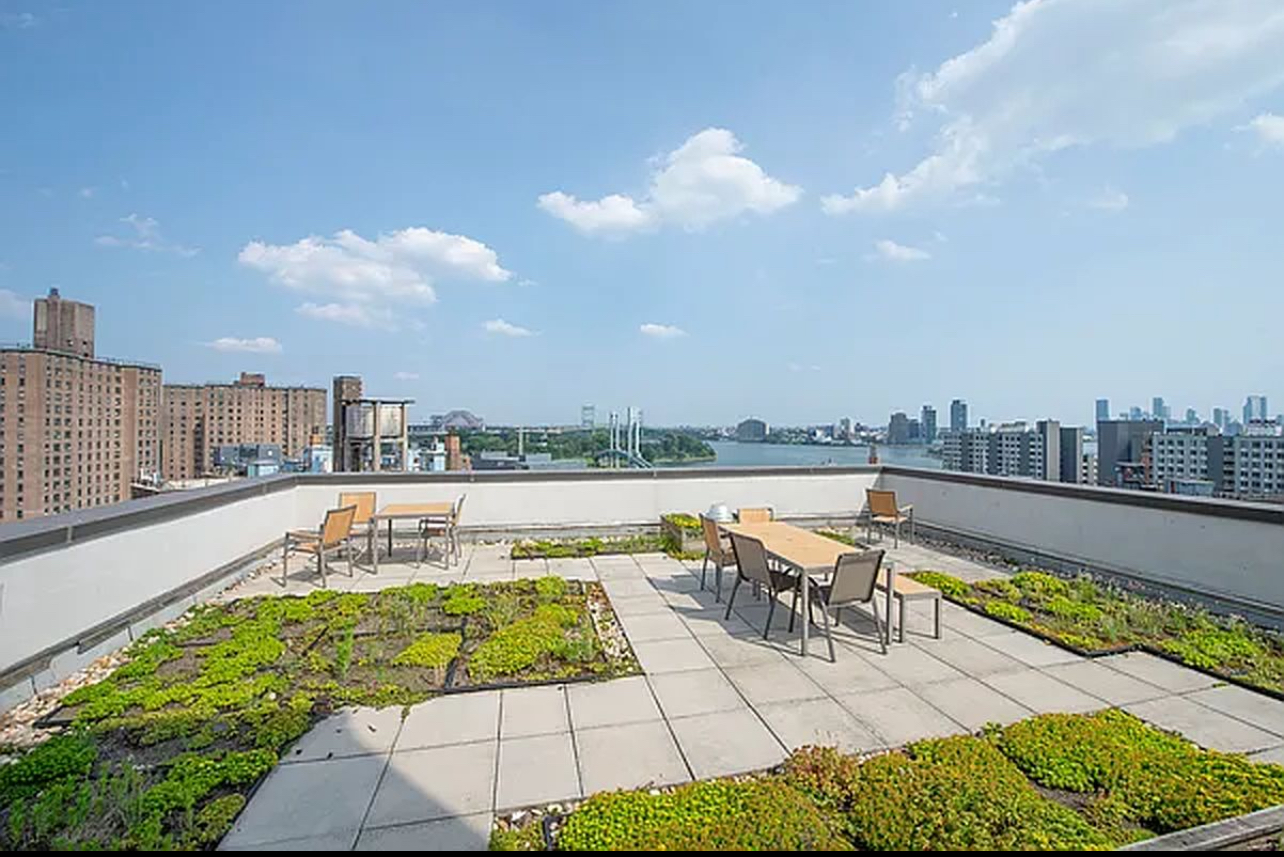 353 East 104th Street, Unit 5A Manhattan, NY 10029 - Photo 3 of 4 a view of a swimming pool with a lounge chair
