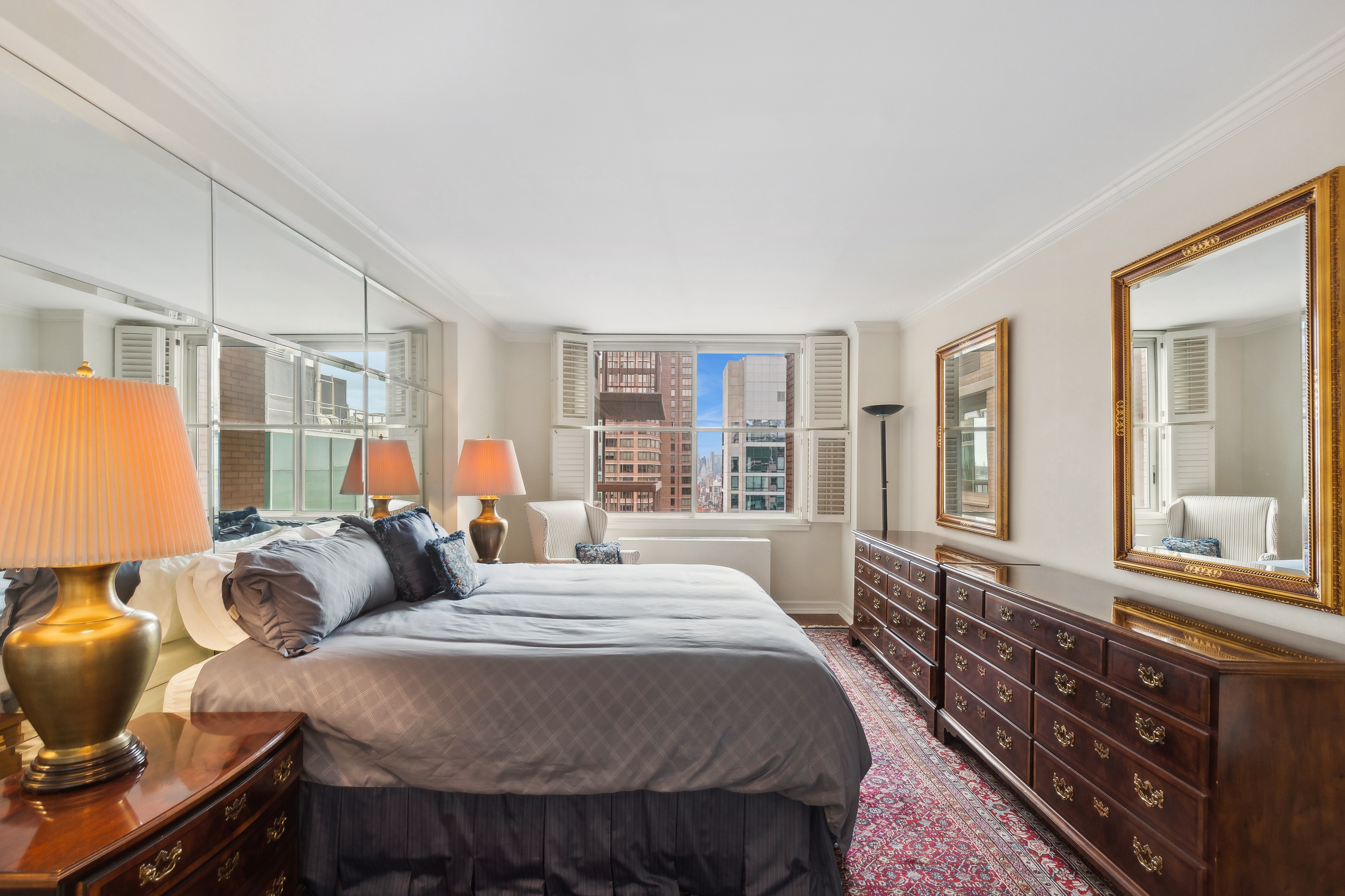 235 East 40th Street, Unit 37C Manhattan, NY 10016 - Photo 4 of 10 a bedroom with furniture and a window