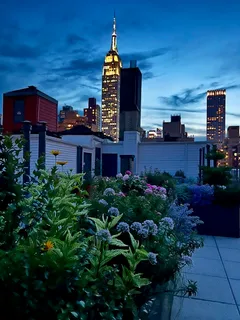 a front view of a building with a garden
