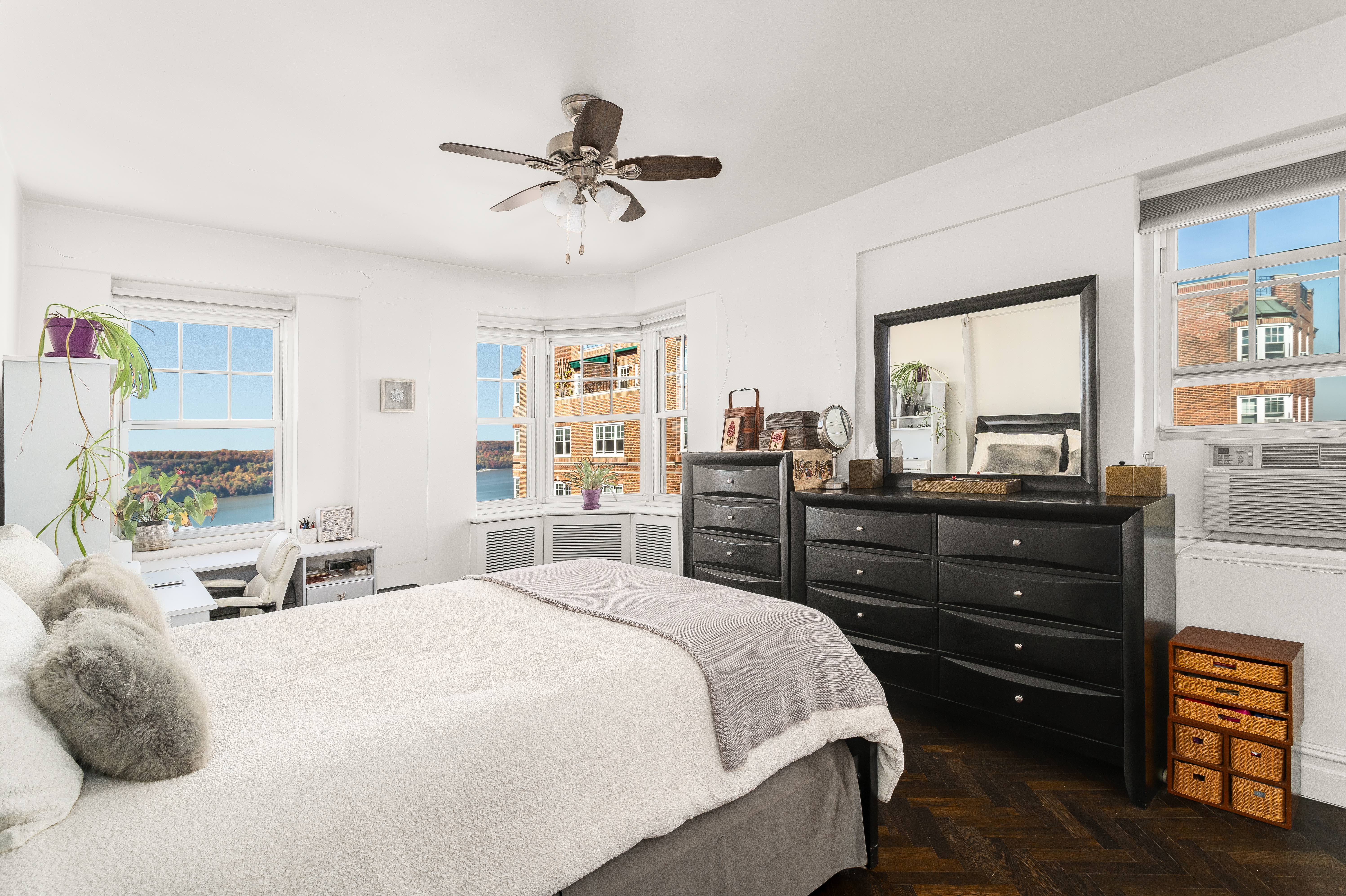 140 Cabrini Boulevard, Unit PH138 Manhattan, NY 10033 - Photo 10 of 30 a bedroom with a bed and wooden floor