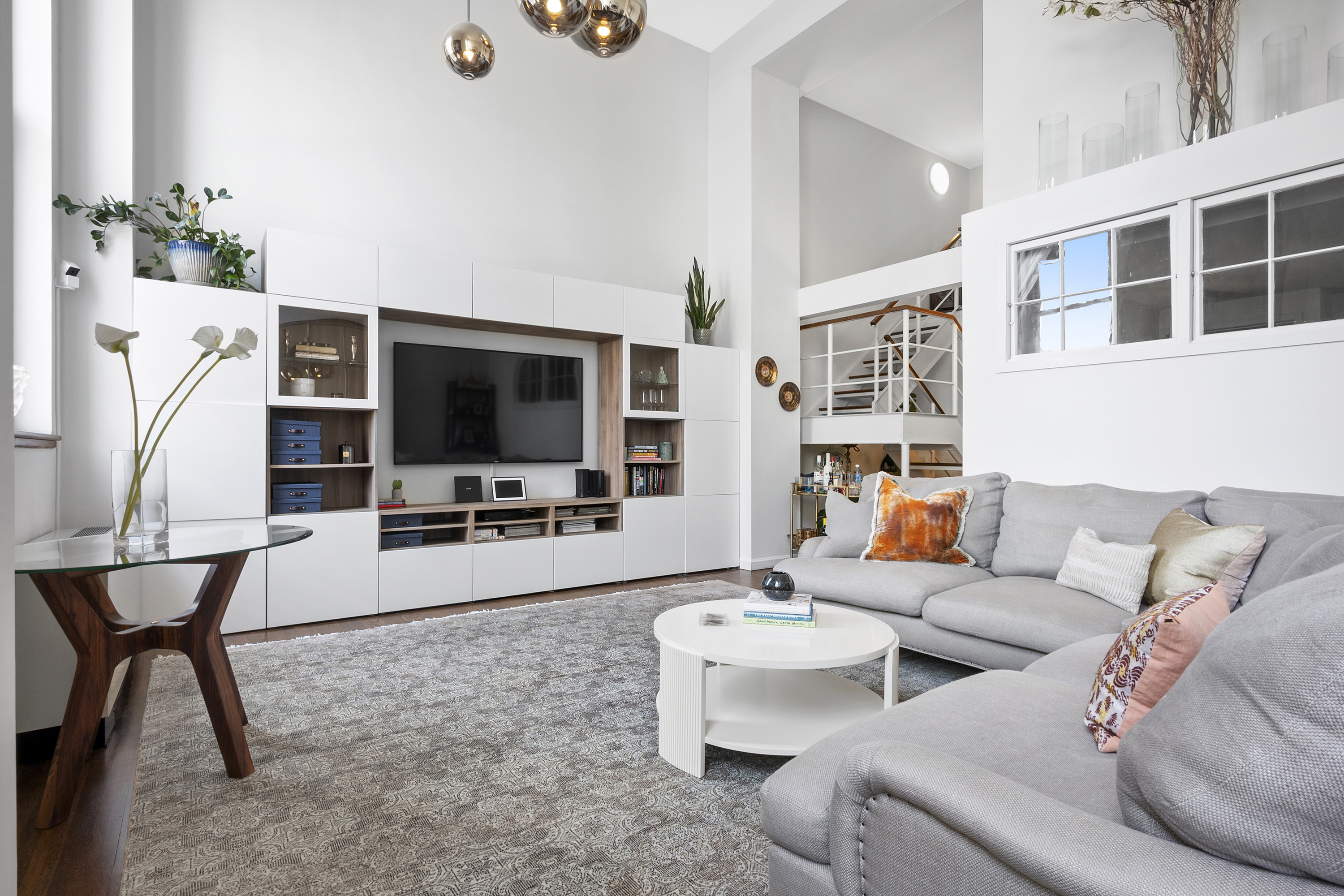 305 2nd Avenue, Unit 516 Manhattan, NY 10003 - Photo 19 of 21 a living room with furniture and a flat screen tv