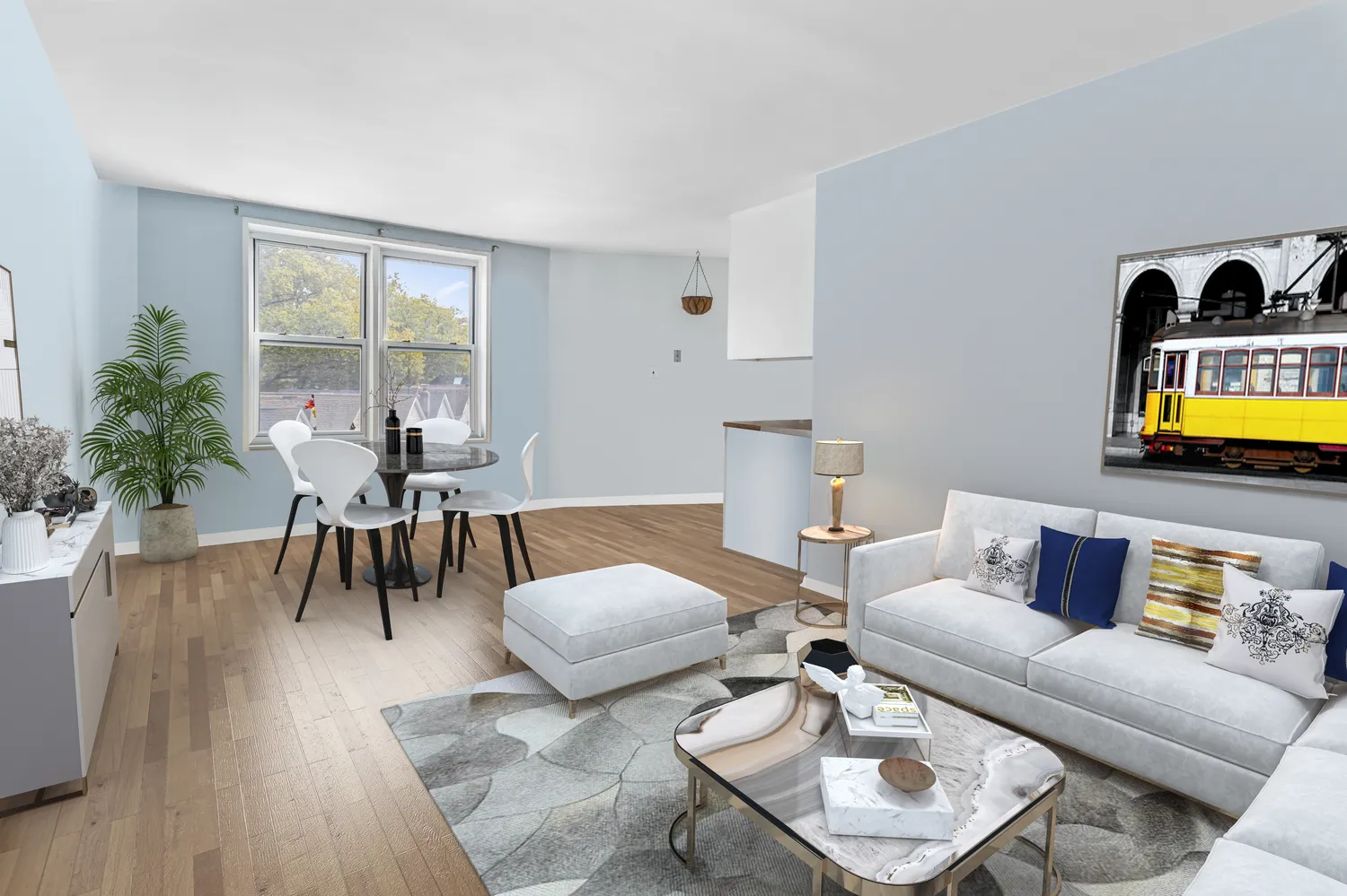 a living room with furniture and wooden floor