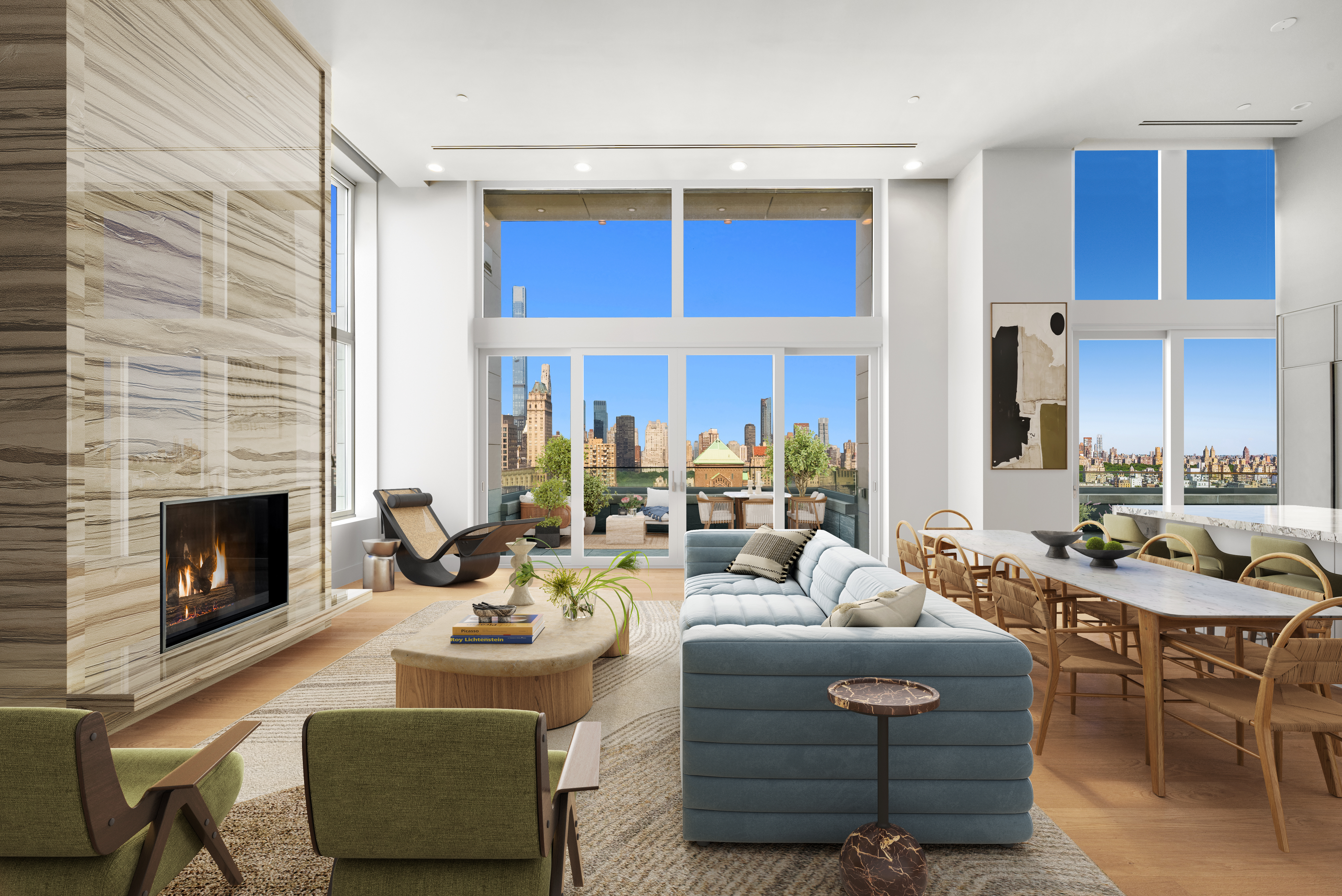 a living room with furniture a fireplace and a dining table