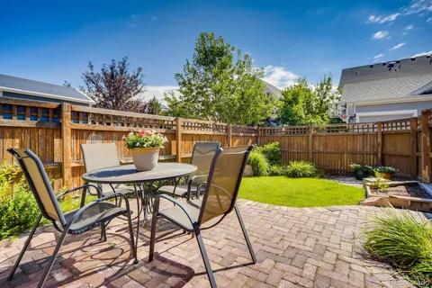 a view of an chairs and table in the patio