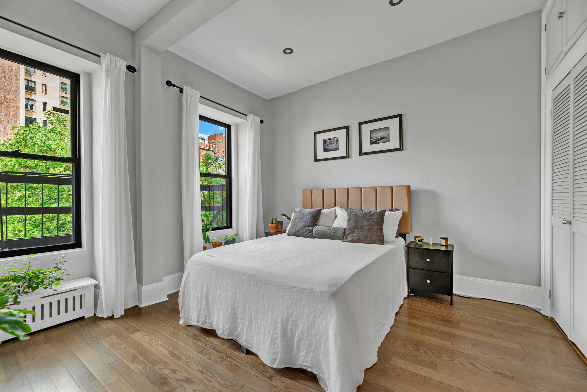 72 East 93rd Street, Unit 5 Manhattan, NY 10128 - Photo 10 of 17 a bedroom with a bed and a window