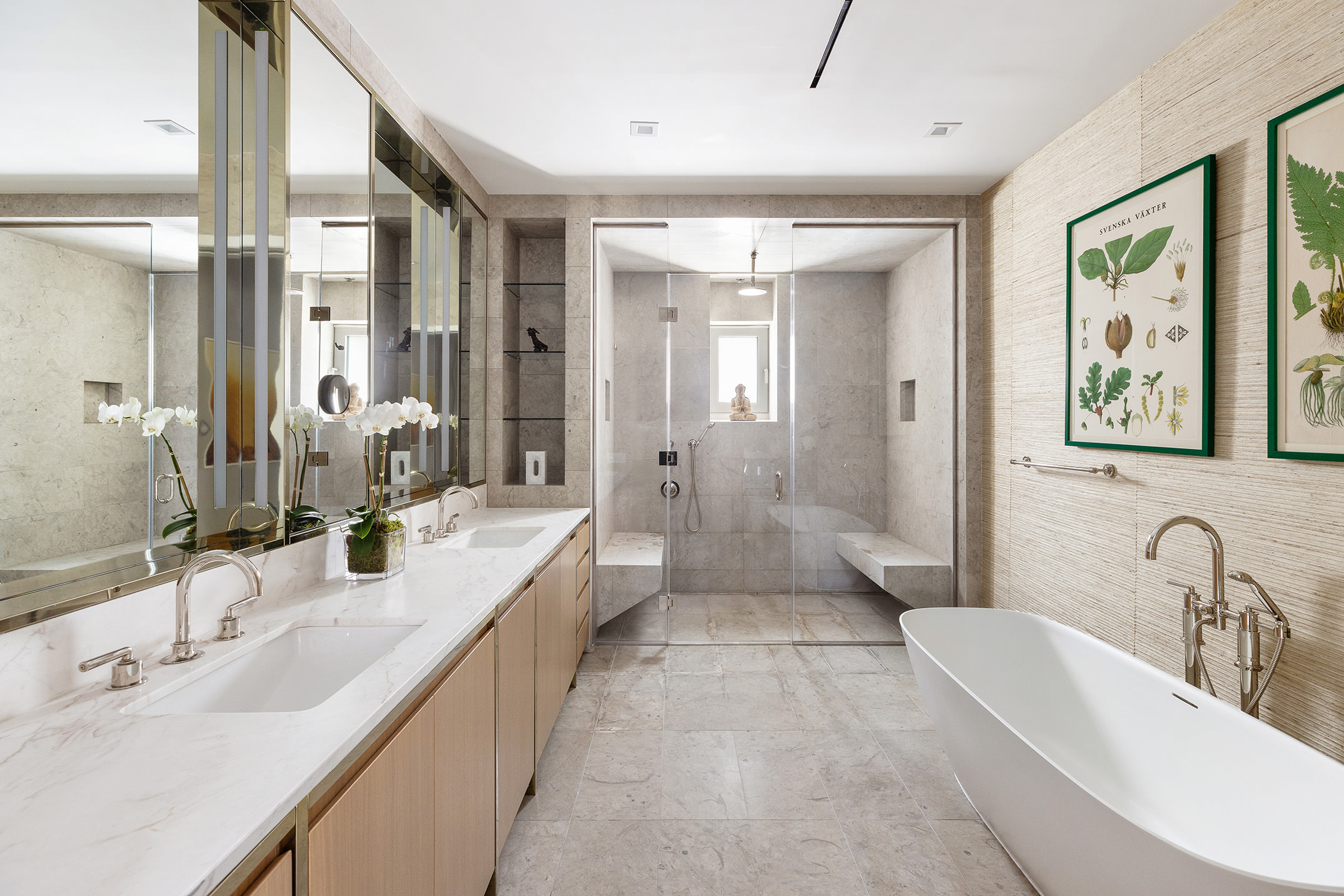 116 University Place, Unit 5 Manhattan, NY 10003 - Photo 11 of 19 a bathroom with double vanity sinks a large mirror and a shower