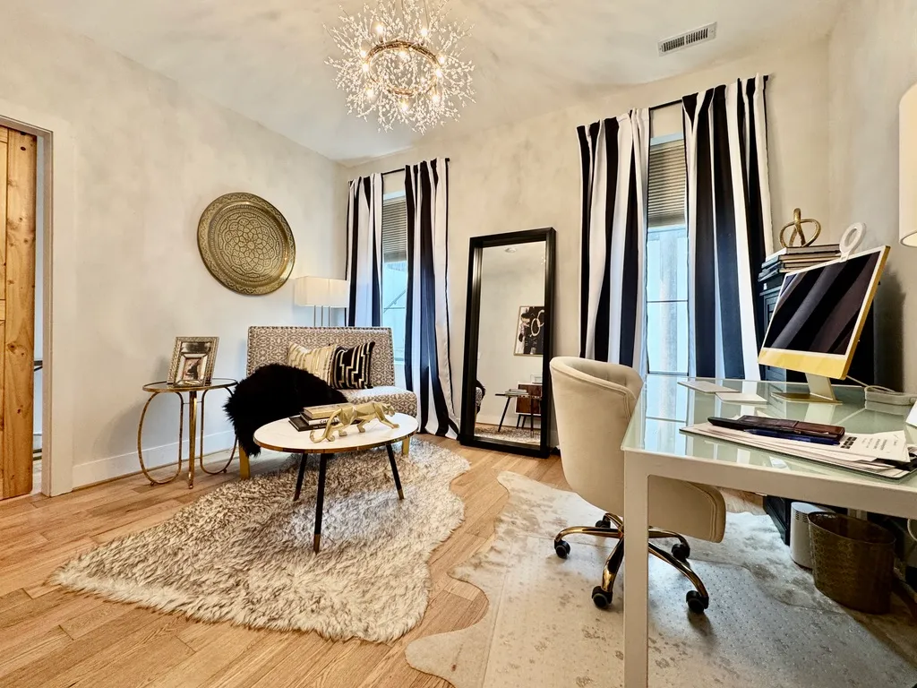 a work room with furniture and a window