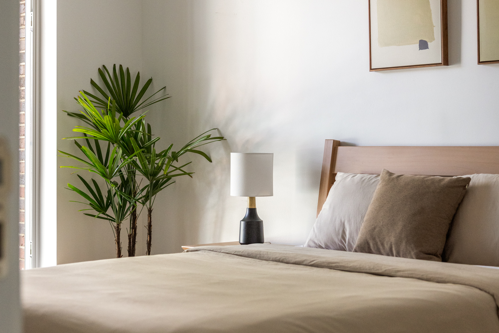 90 Herbert Street, Unit 4A Brooklyn, NY 11222 - Photo 7 of 10 a bedroom with a bed and a potted plant