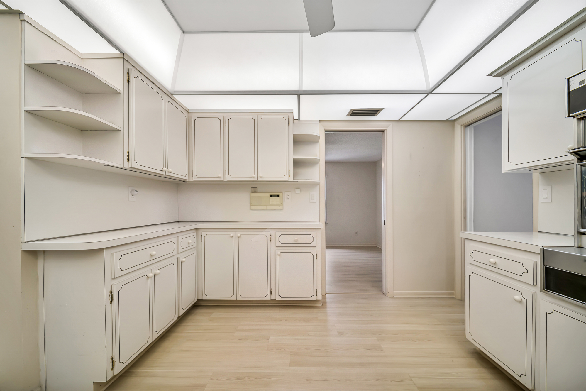 6760 Southwest 62nd Terrace Miami, FL 33143 - Photo 28 of 38 a kitchen with white cabinets and white appliances