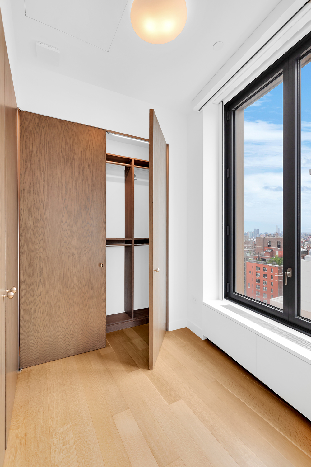 21 East 12th Street, Unit 19B Manhattan, NY 10003 - Photo 8 of 17 a view of an empty room with a window