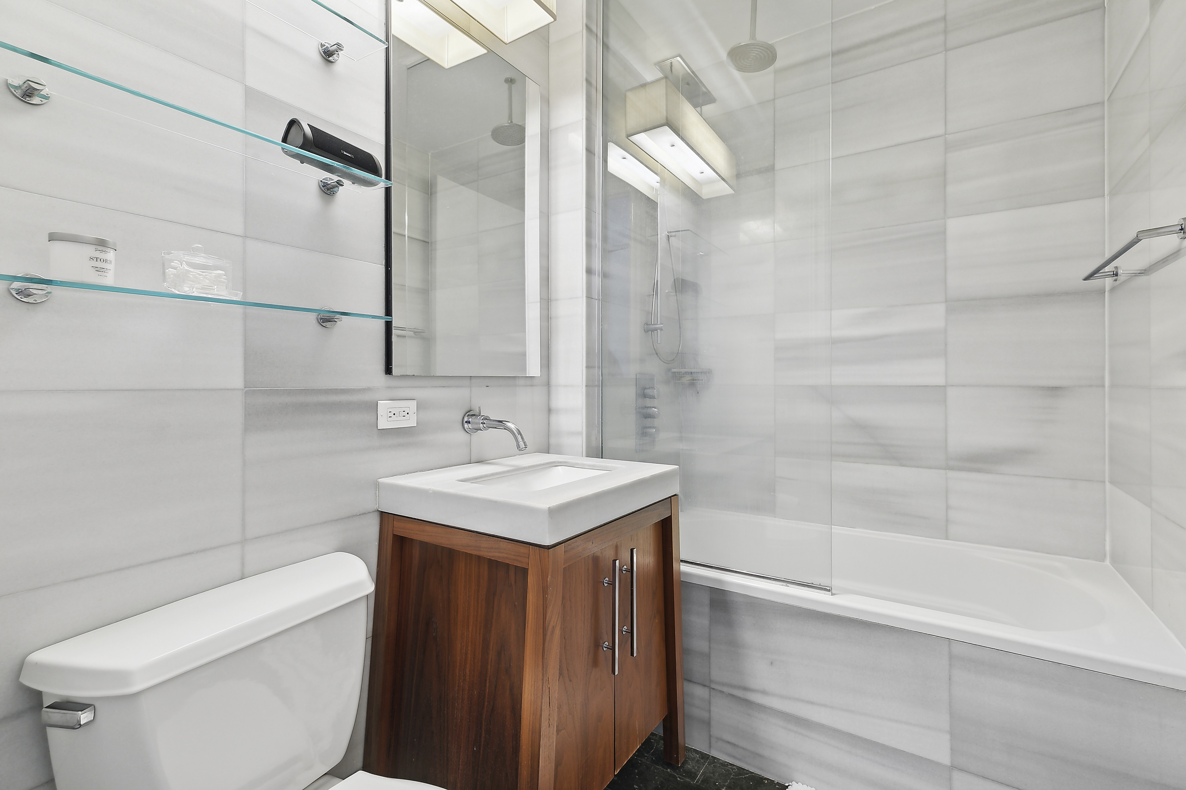 88 Greenwich Street, Unit 3003 Manhattan, NY 10006 - Photo 4 of 19 a bathroom with a sink a toilet and shower