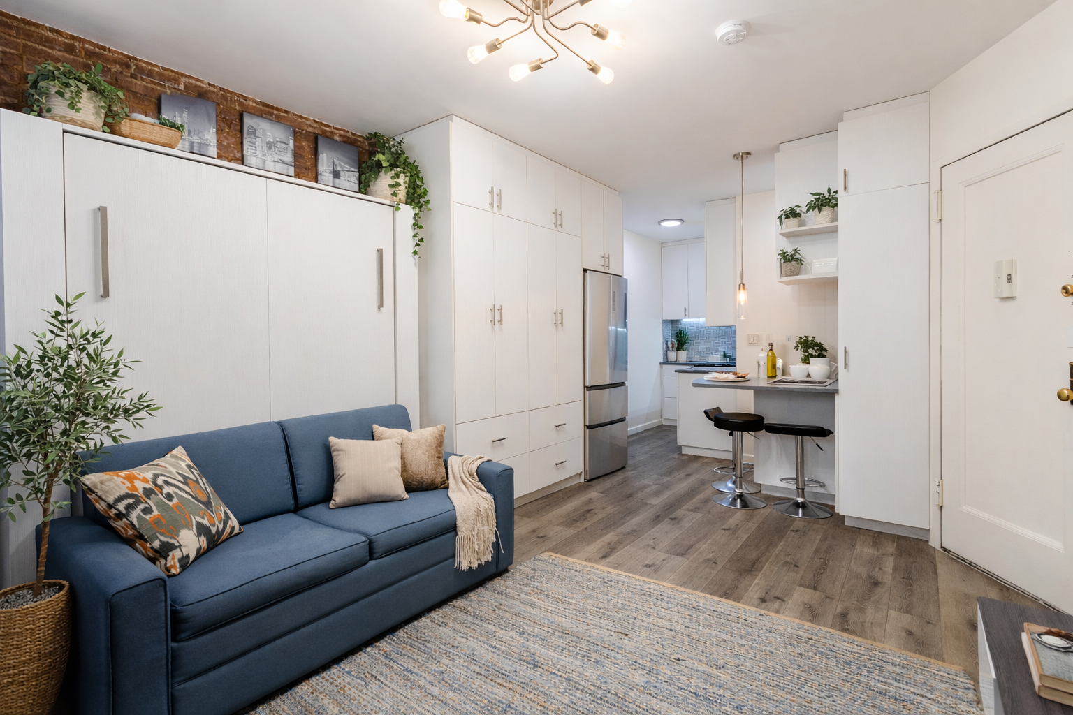 a living room with furniture and a wooden floor