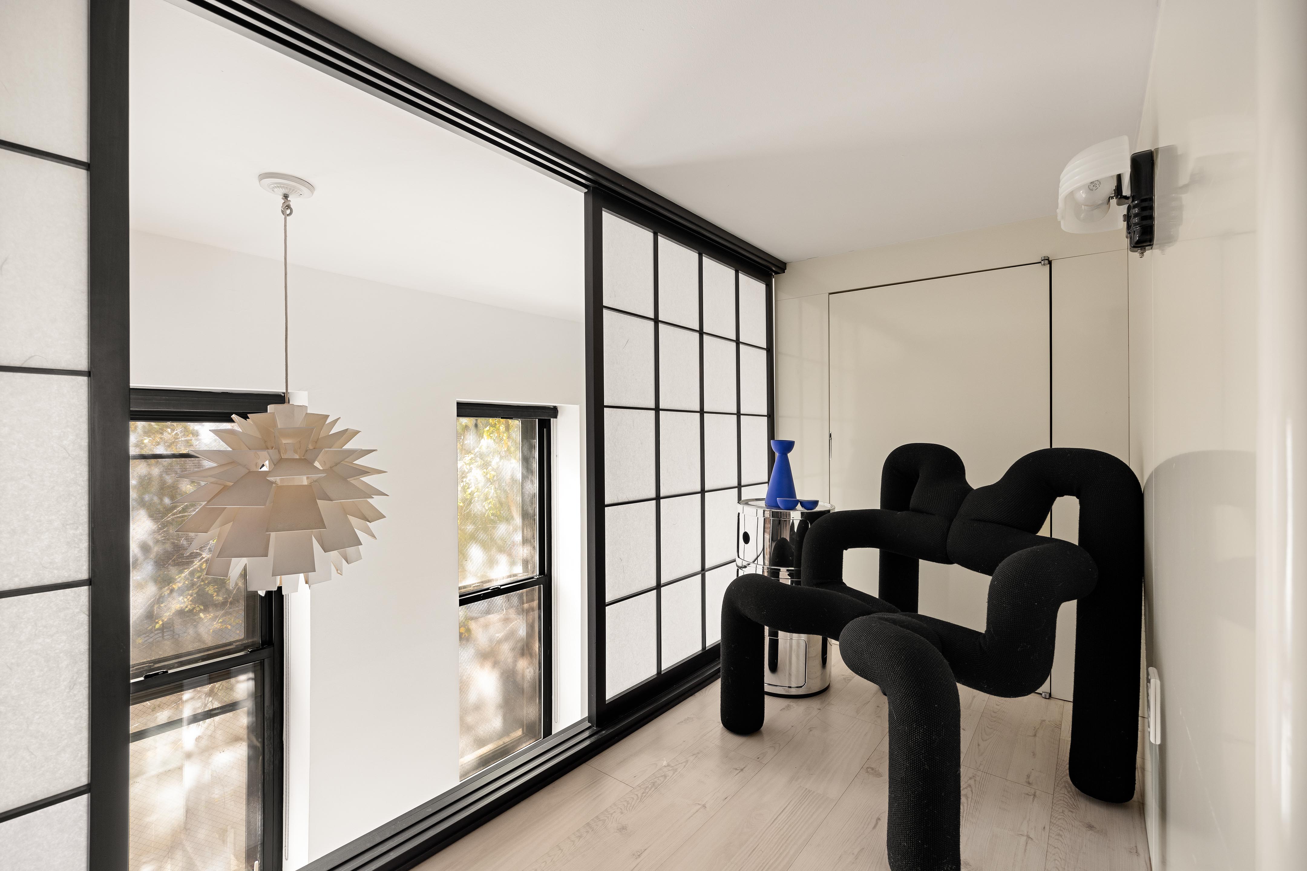 300 East 4th Street, Unit 2A Manhattan, NY 10009 - Photo 10 of 15 a view of living room filled with furniture and window