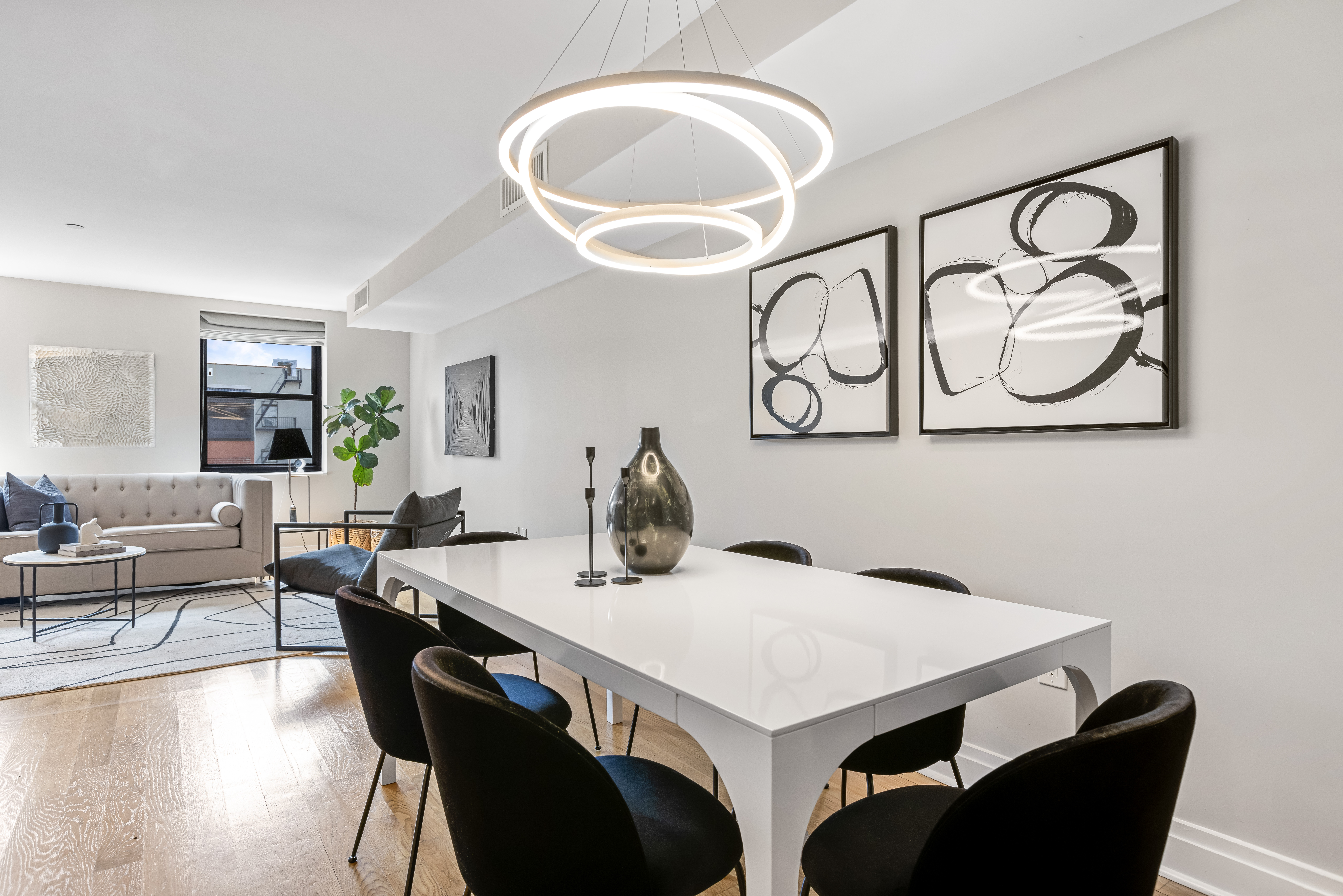 257 West 117th Street, Unit 6A Manhattan, NY 10026 - Photo 3 of 16 a view of a dining room with furniture and wooden floor