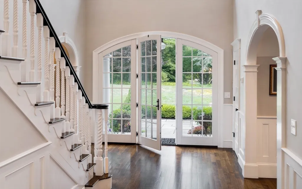 a view of front door and porch with wooden floor