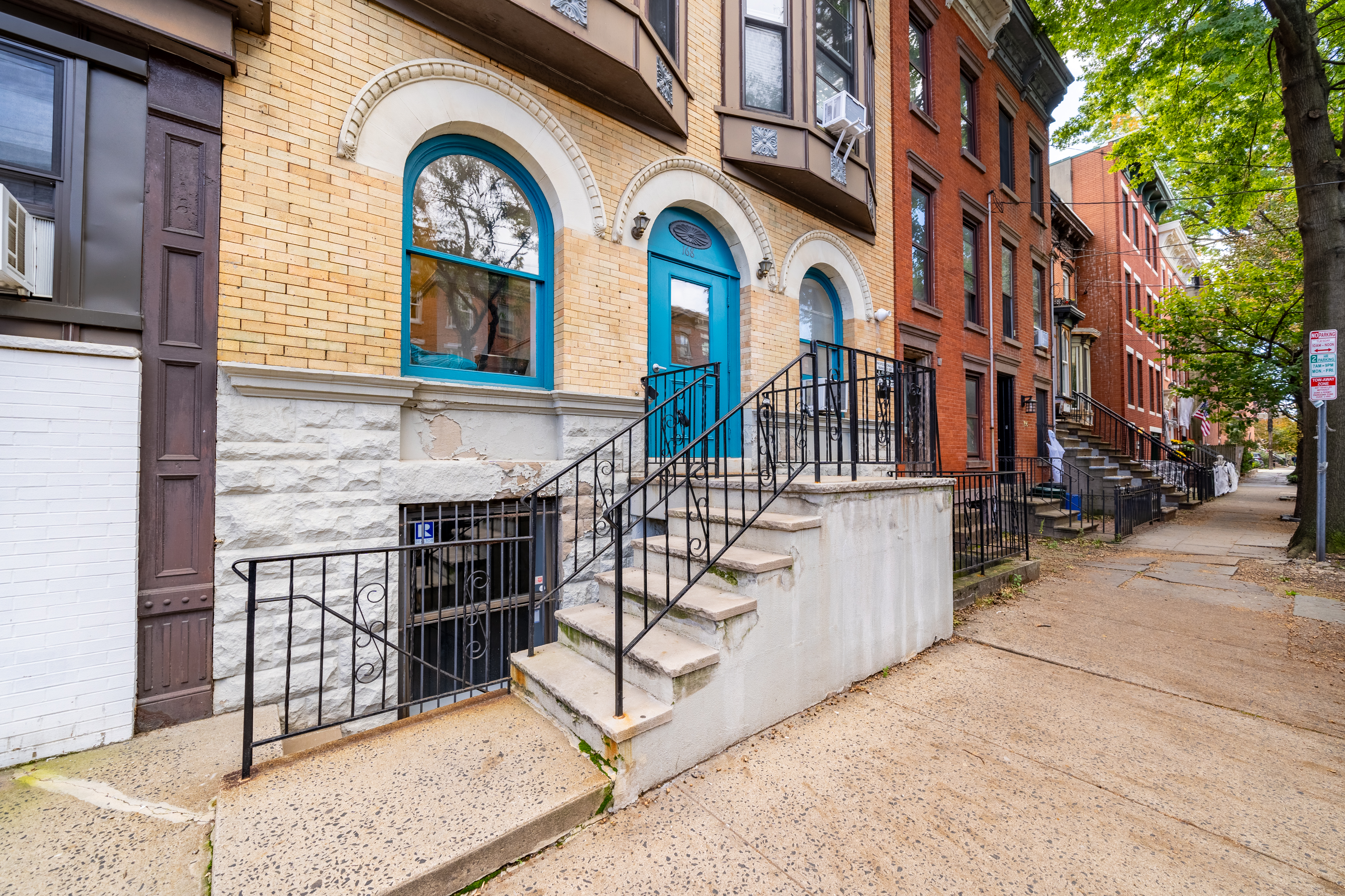168 Coles Street, Unit BA Jersey City, NJ 07302 - Photo 17 of 29 a view of a brick building with a large windows