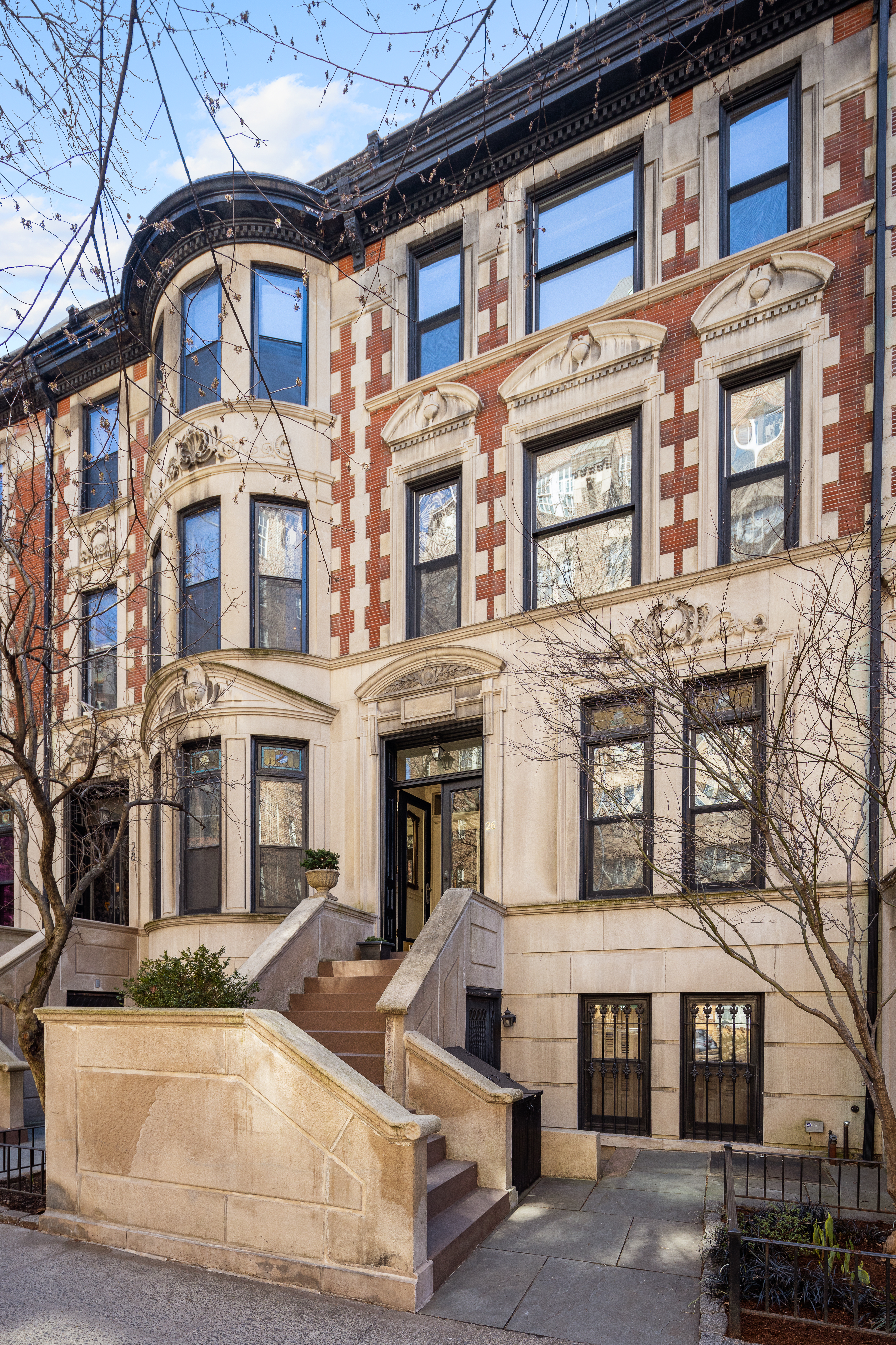 26 Pierrepont Street, Unit 2 Brooklyn, NY 11201 - Photo 19 of 21 a front view of a residential apartment building with a yard