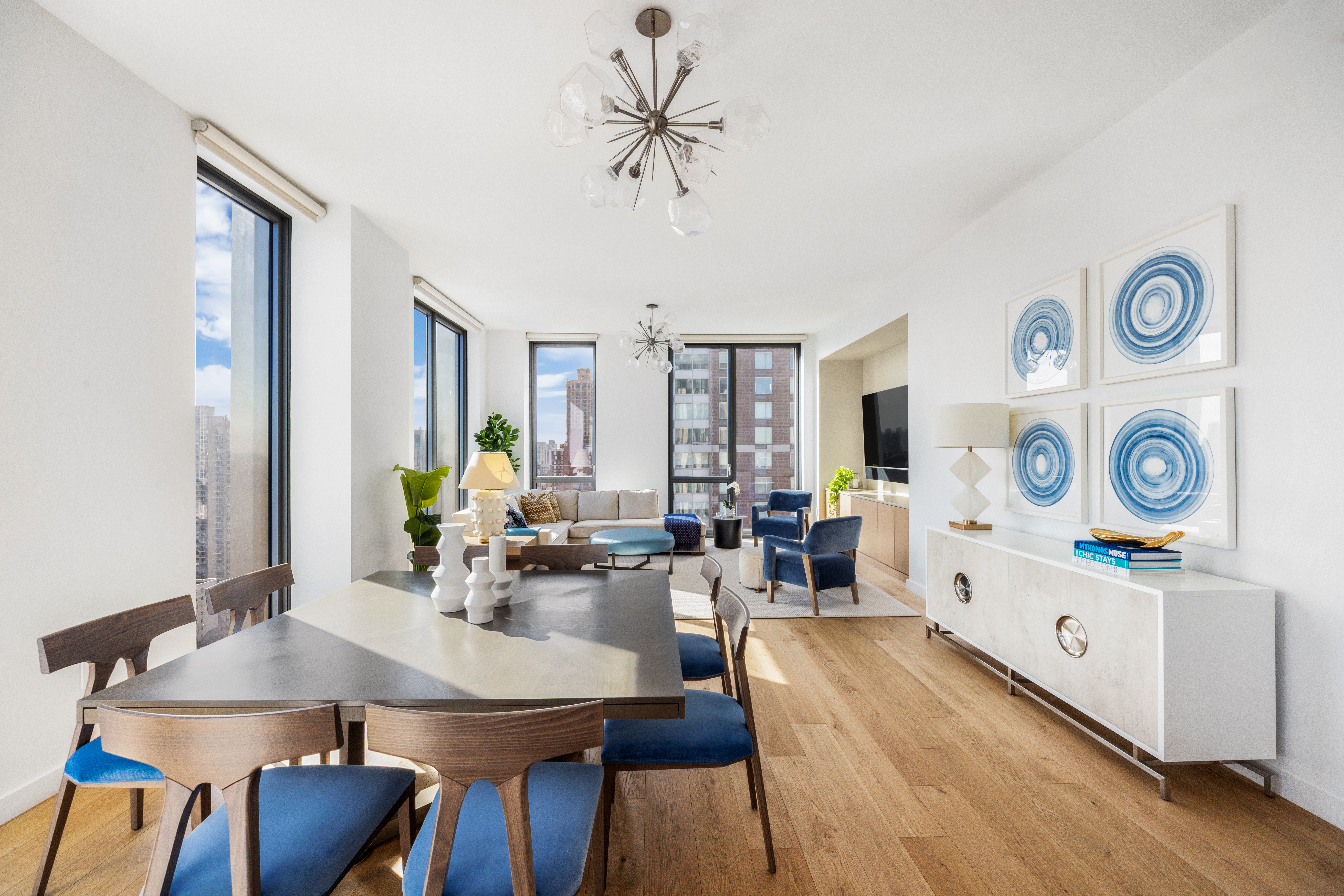 360 East 89th Street, Unit 29B Manhattan, NY 10128 - Photo 2 of 22 a view of a dining room with furniture and wooden floor