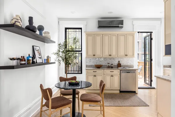 a kitchen with stainless steel appliances kitchen island granite countertop a sink and cabinets