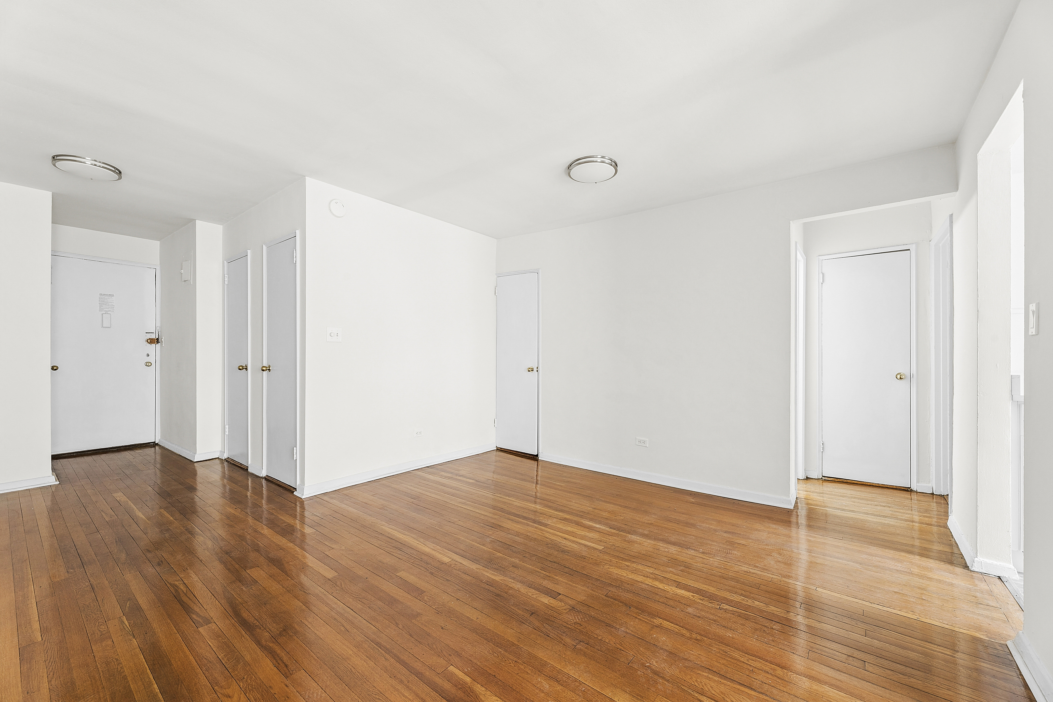 6645 Broadway, Unit 7E Bronx, NY 10471 - Photo 6 of 11 wooden floor in an empty room