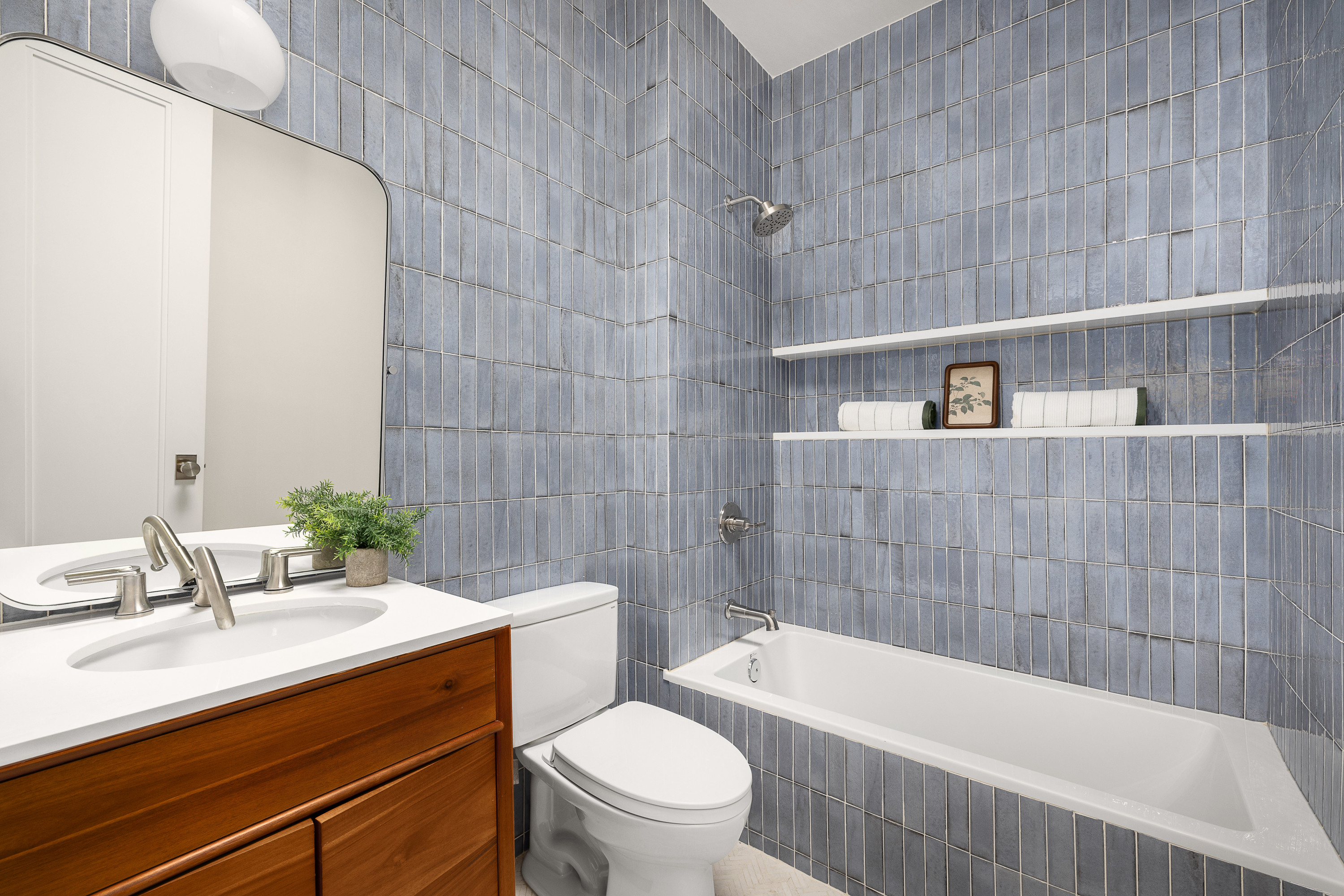 559 MacDonough Street Brooklyn, NY 11233 - Photo 13 of 17 a bathroom with a sink a toilet and shower
