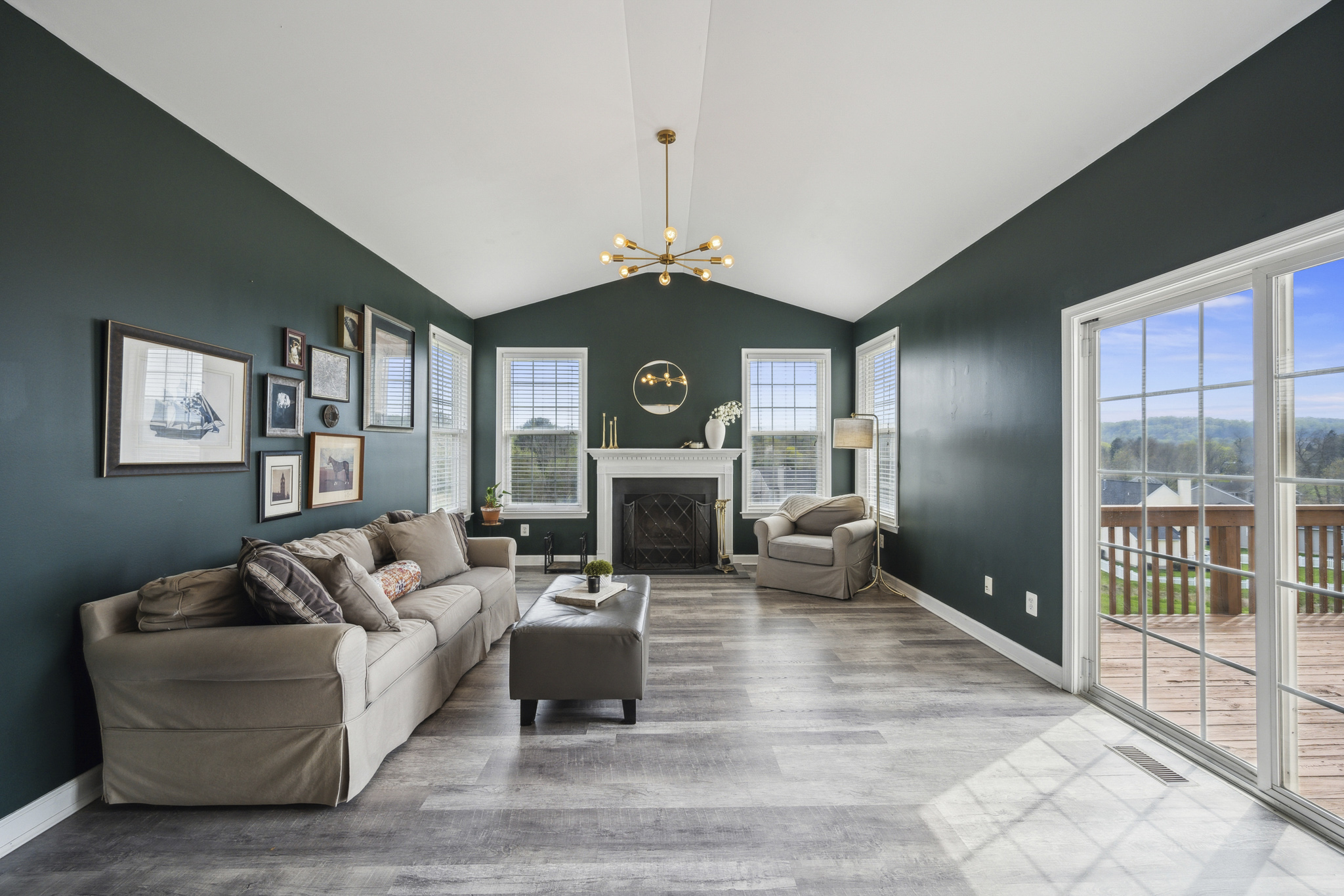 127 Hartman Road Pottstown, PA 19465 - Photo 12 of 42 a living room with furniture a fireplace and a chandelier