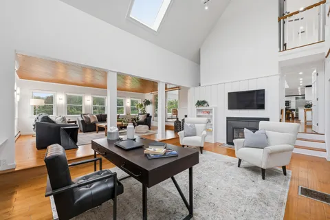 a bathroom with a sink mirror vanity and toilet
