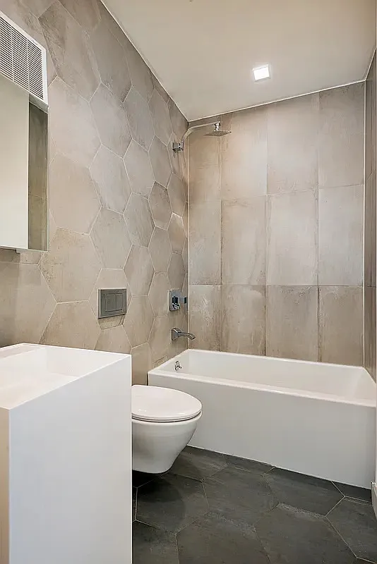 30 Starr Street, Unit 4B Brooklyn, NY 11221 - Photo 5 of 5 a bathroom with a sink a toilet and a bathtub