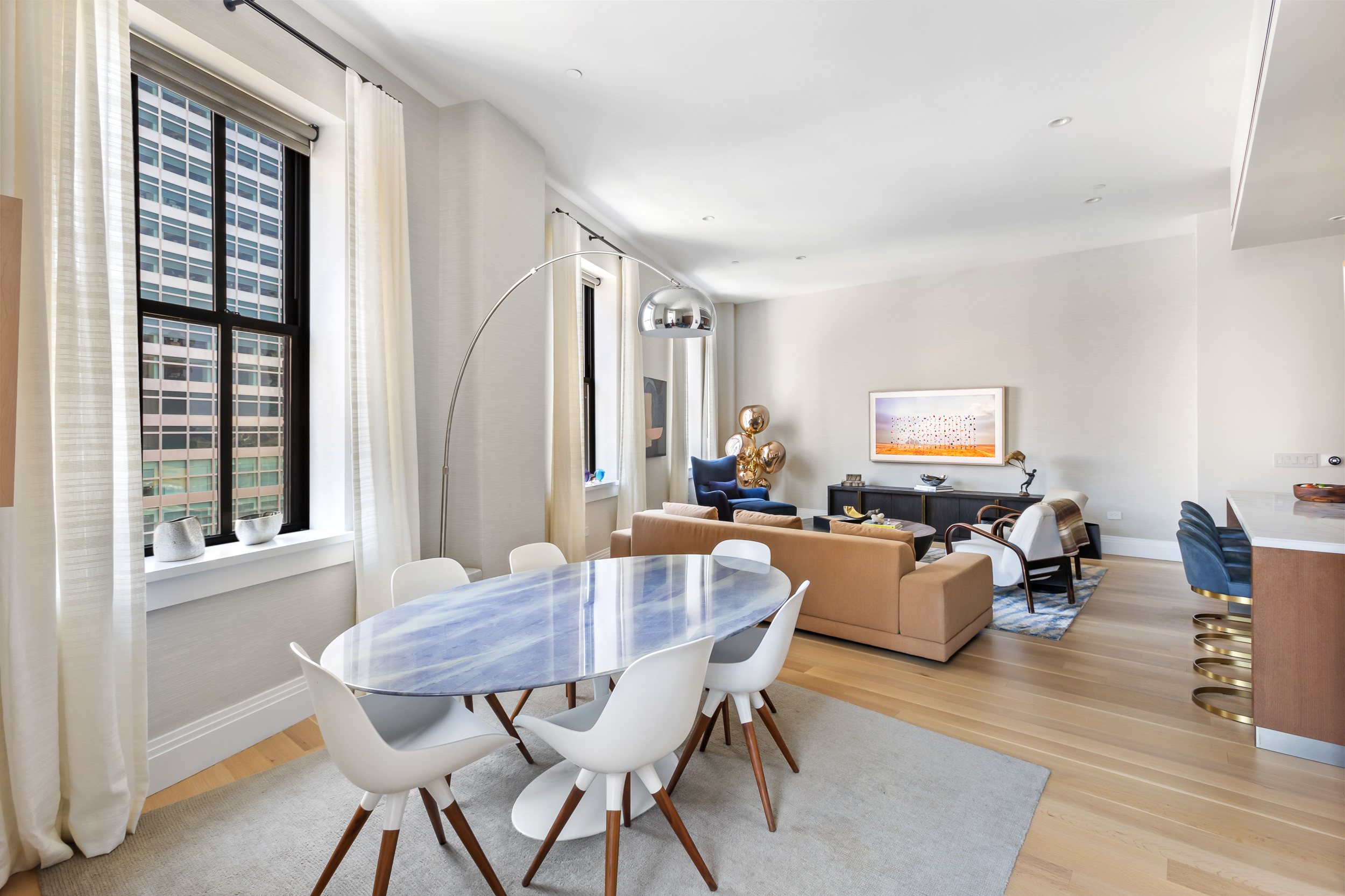 100 Barclay Street, Unit 17A Manhattan, NY 10007 - Photo 2 of 24 a view of a dining room with furniture window and wooden floor