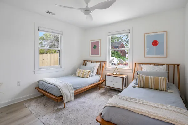 a spacious bedroom with a bed and window