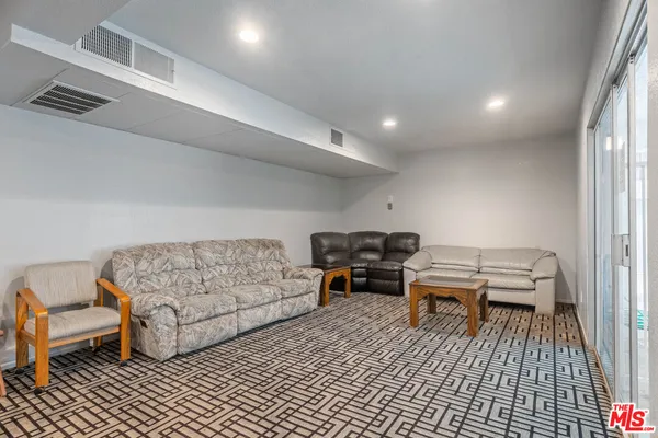 a living room with furniture and a couch