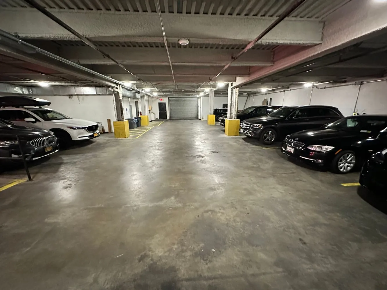 a view of parking garage with cars
