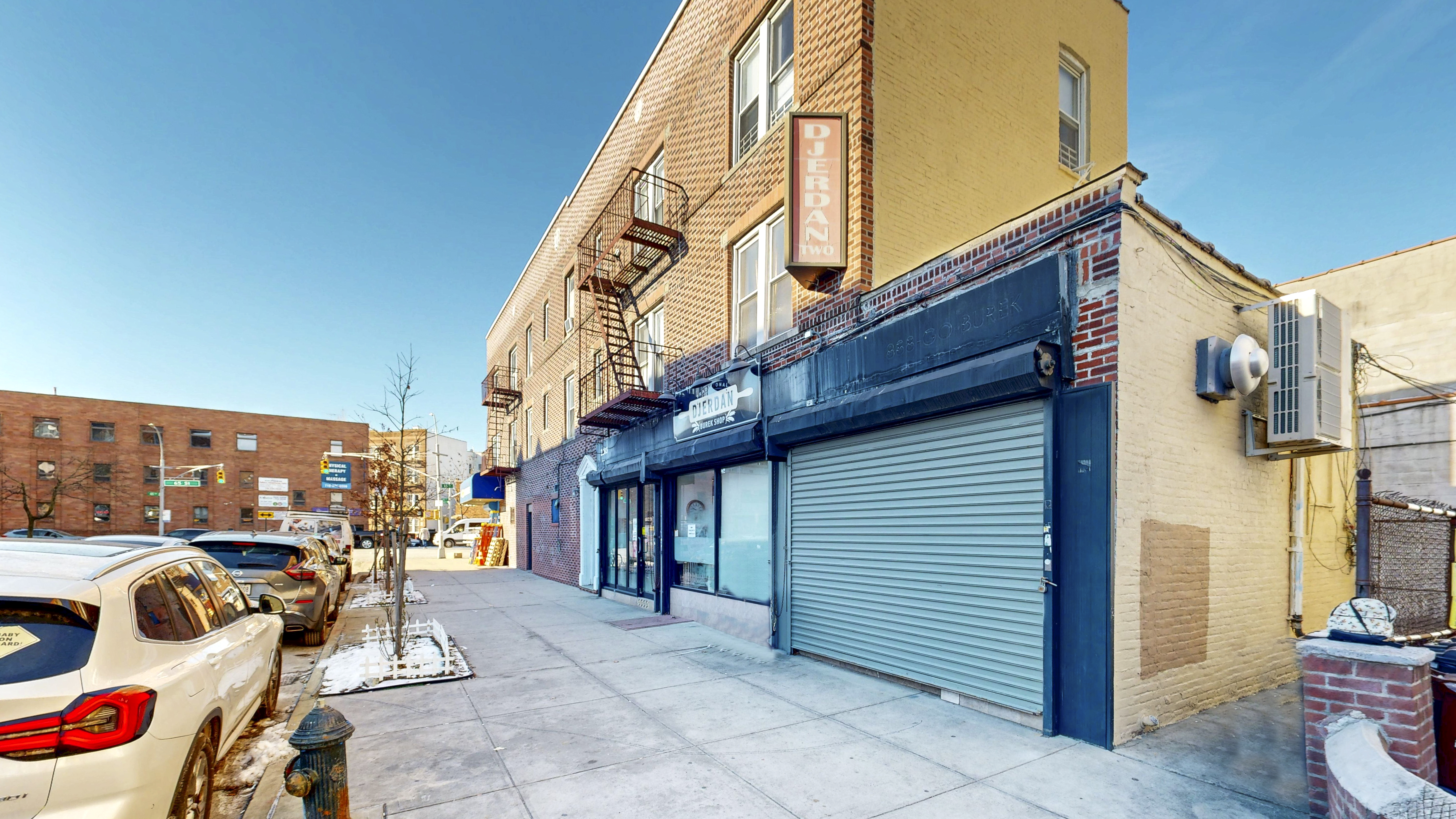 2283 65th Street Brooklyn, NY 11204 - Photo 3 of 3 a view of a patio with a table and chairs