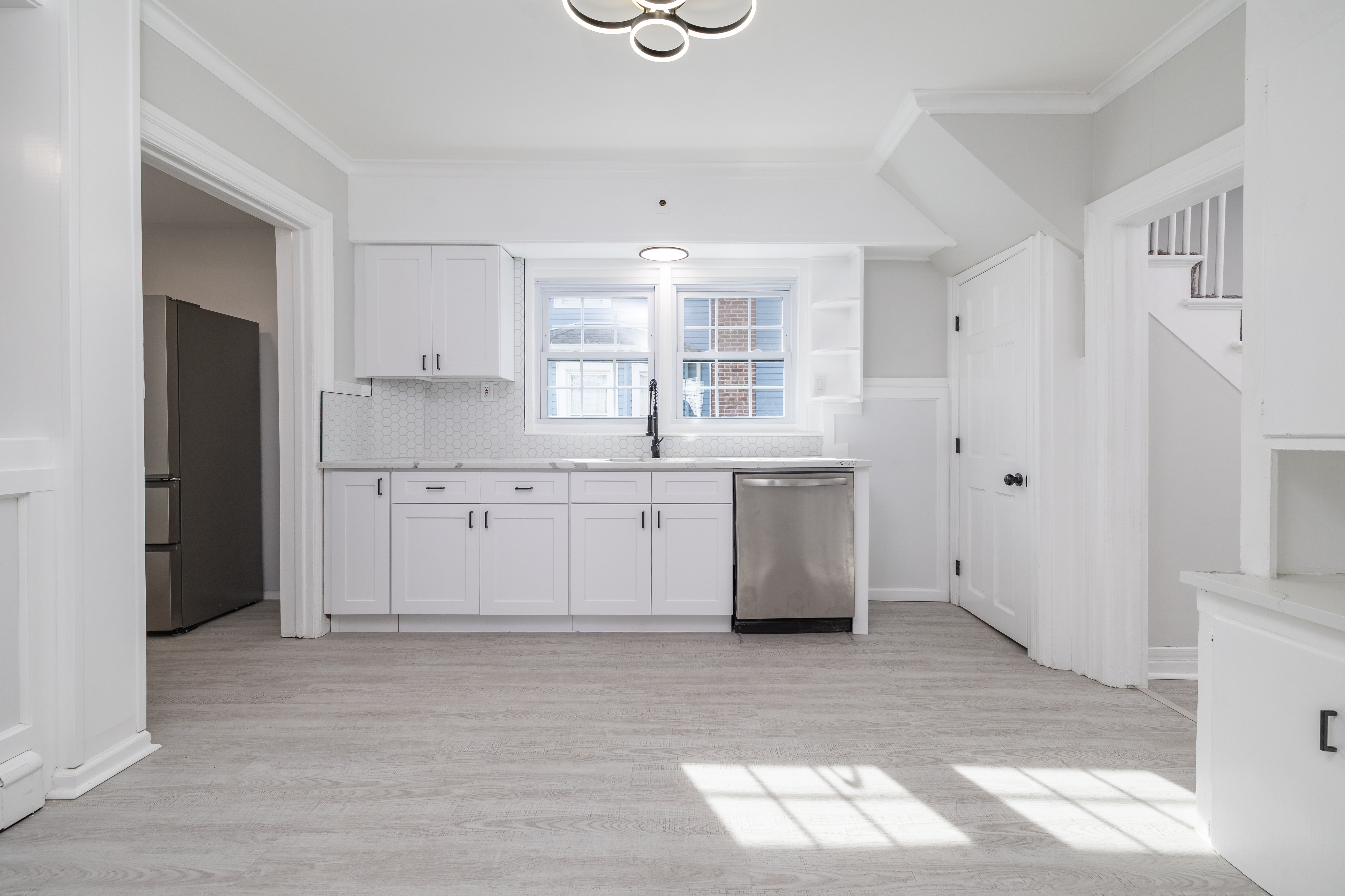 13-03 Brunswick Avenue Queens, NY 11691 - Photo 5 of 27 a view of cabinets a center island a refrigerator and a window