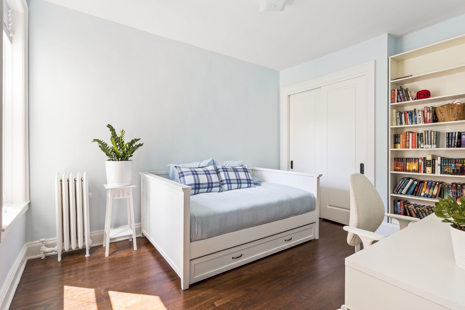 474 Prospect Place, Unit 3 Brooklyn, NY 11238 - Photo 10 of 11 a bedroom with a bed and a book shelf