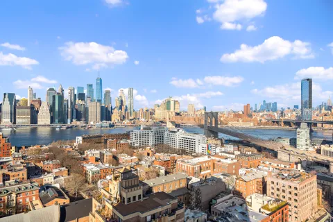 a view of a city with tall buildings