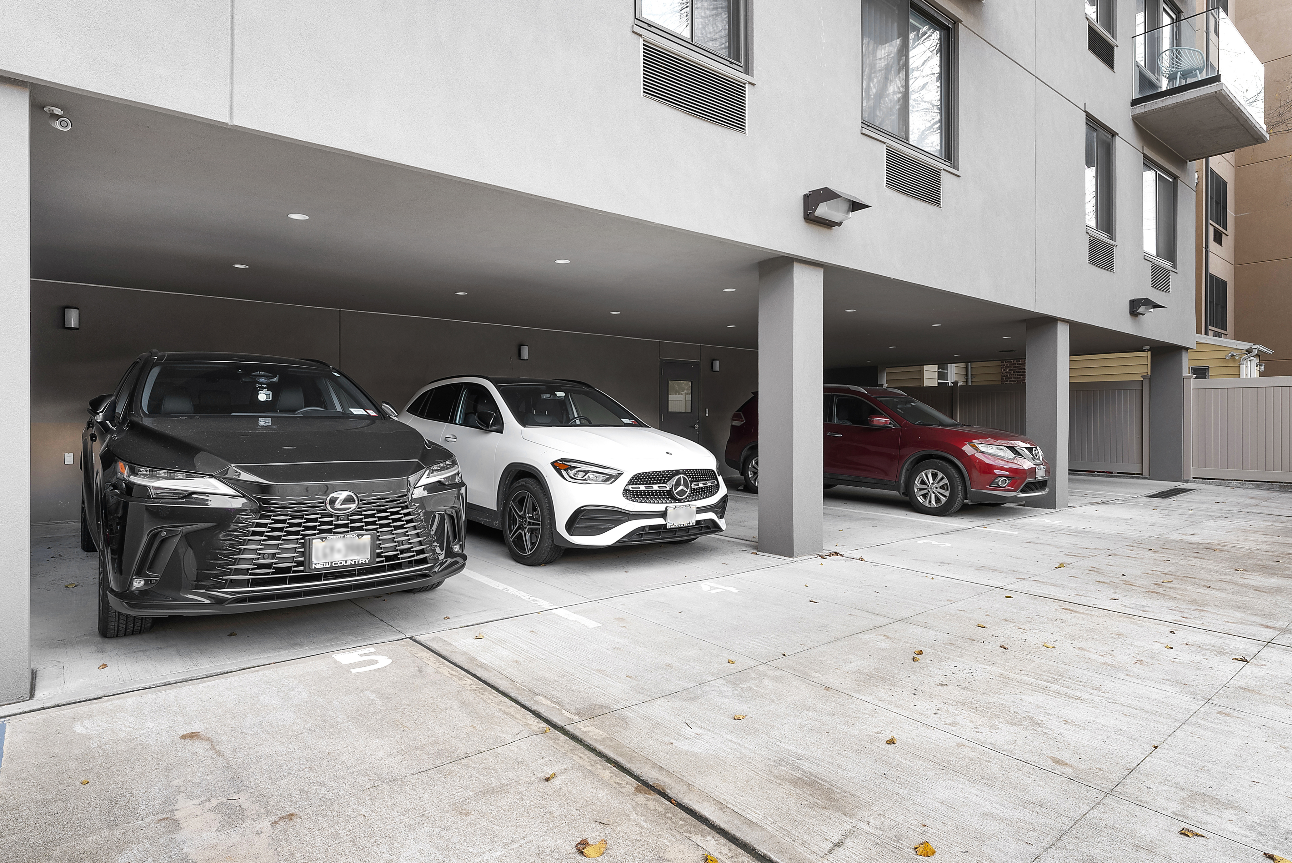 23-43 31st Road, Unit 3C Queens, NY 11106 - Photo 7 of 10 a car parked in parking area of a building