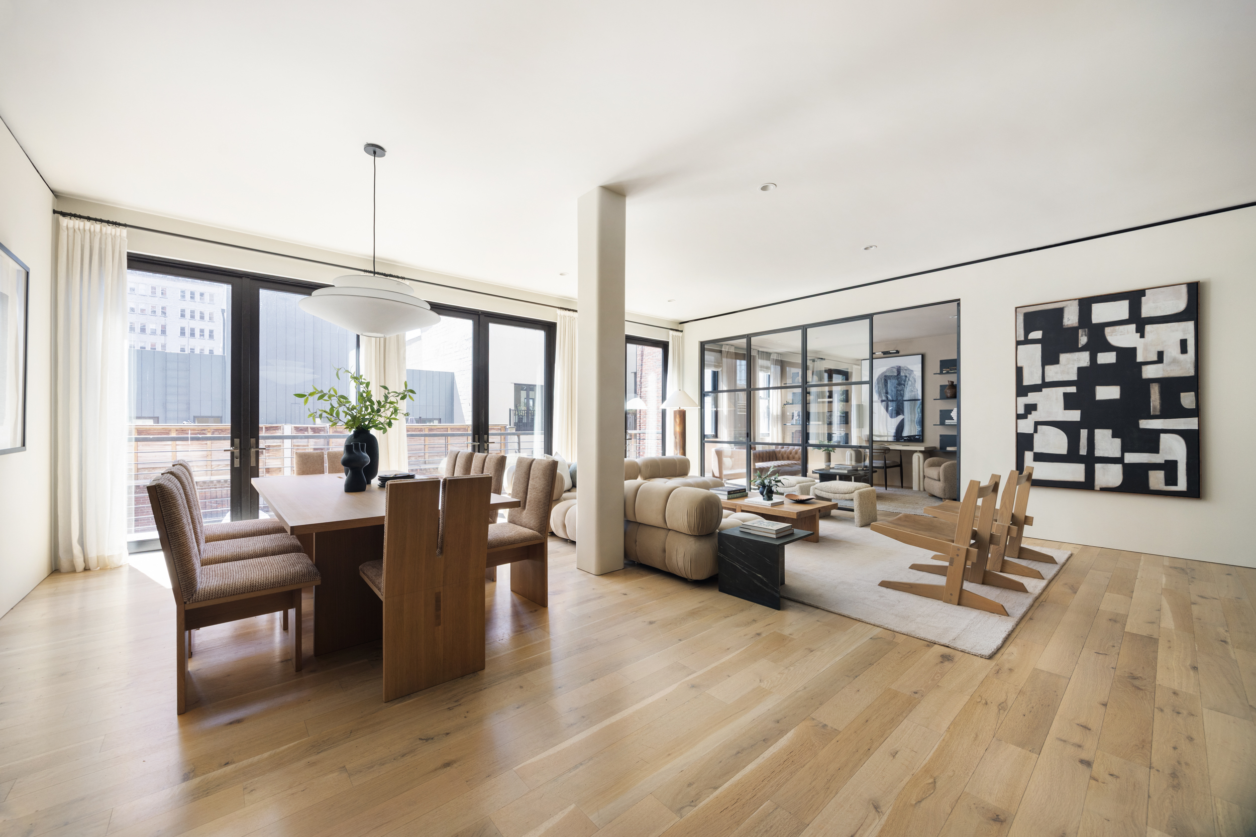 110 Duane Street, Unit PH3S Manhattan, NY 10007 - Photo 3 of 23 a living room with furniture and floor to ceiling windows