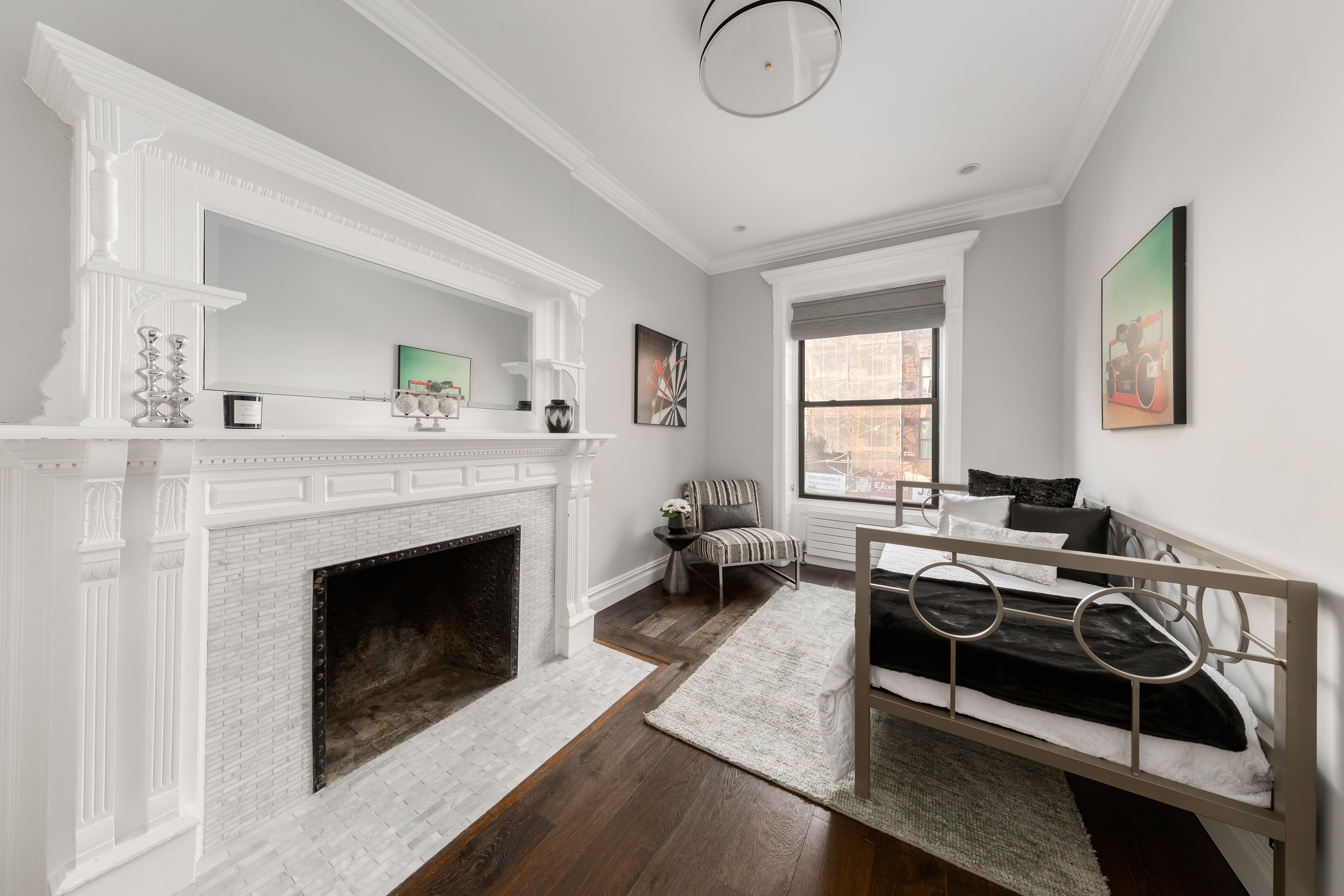 110 West 81st Street Manhattan, NY 10024 - Photo 25 of 30 a living room with furniture a window and a fireplace