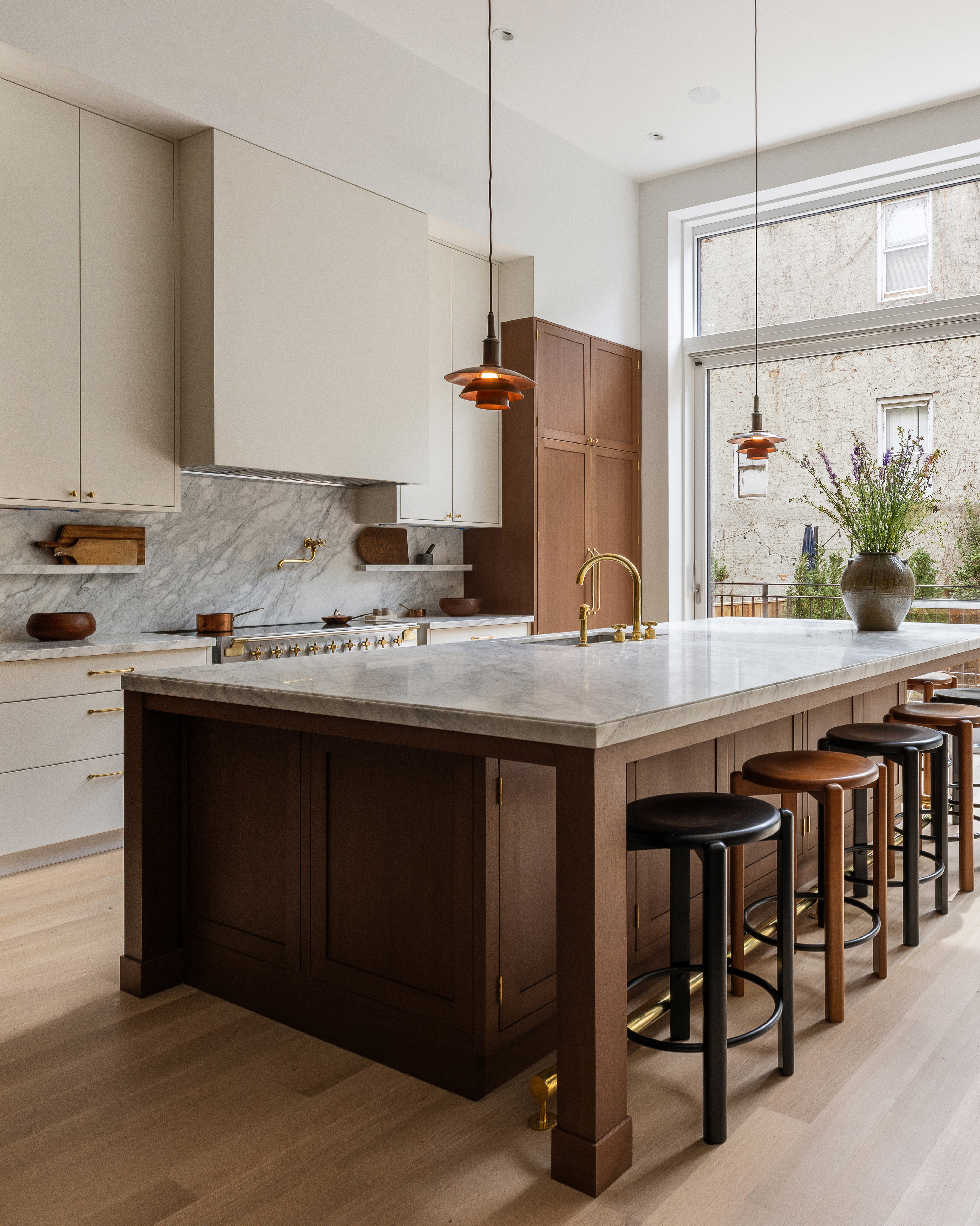 205 Clinton Street Brooklyn, NY 11201 - Photo 13 of 39 a kitchen with a sink a counter and chairs