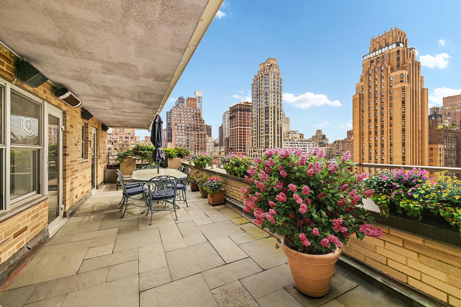 330 East 49th Street, Unit 12E Manhattan, NY 10017 - Photo 1 of 16 a view of a terrace with sitting area