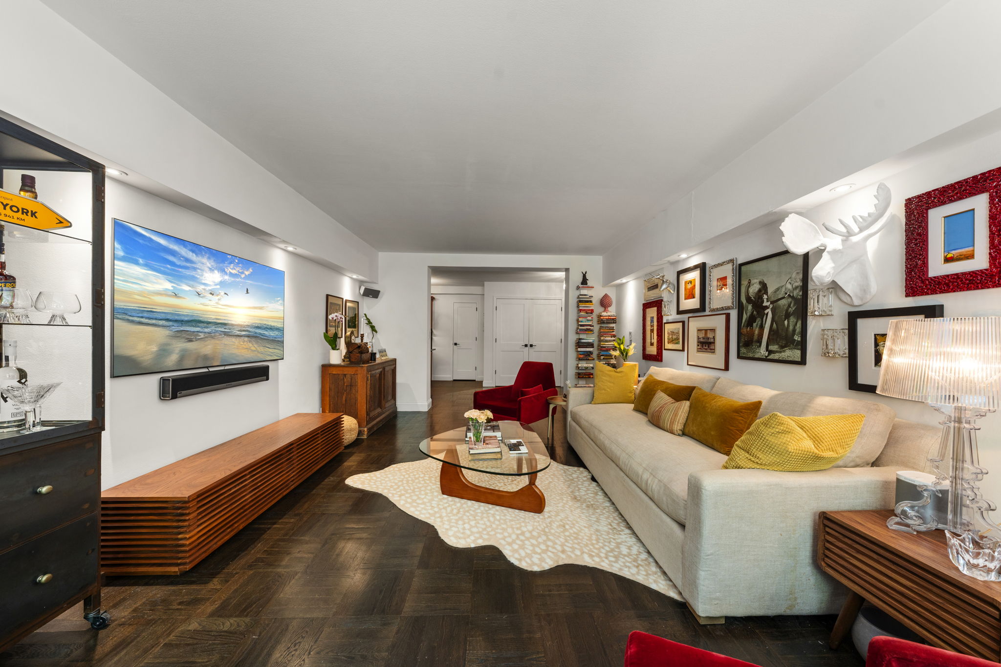 310 Lexington Avenue, Unit 2J Manhattan, NY 10016 - Photo 2 of 11 a living room with furniture and a flat screen tv