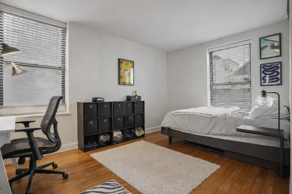 a bed room with a bed and a lamp