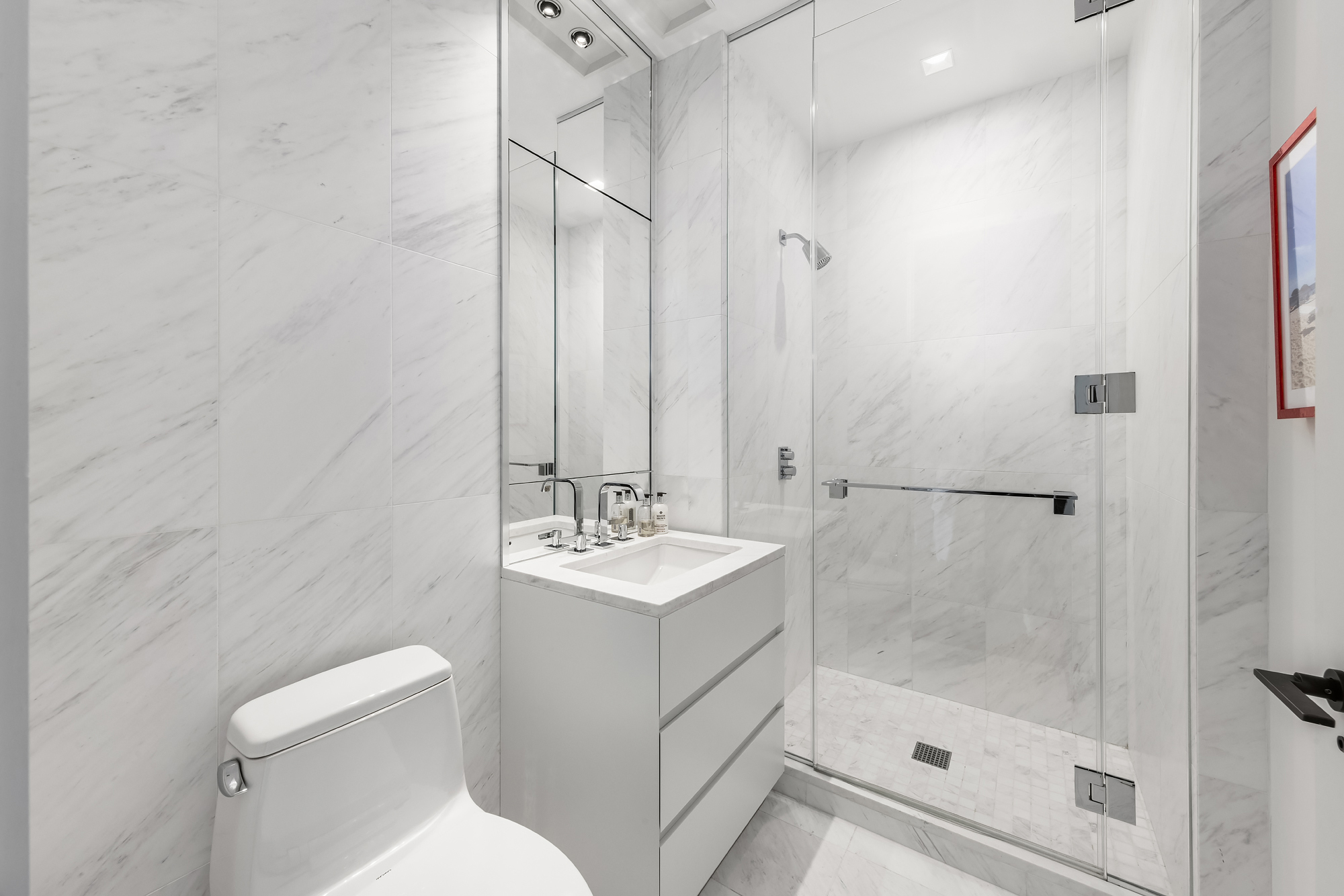 111 Murray Street, Unit 38A Manhattan, NY 10007 - Photo 15 of 29 a bathroom with a sink toilet and shower