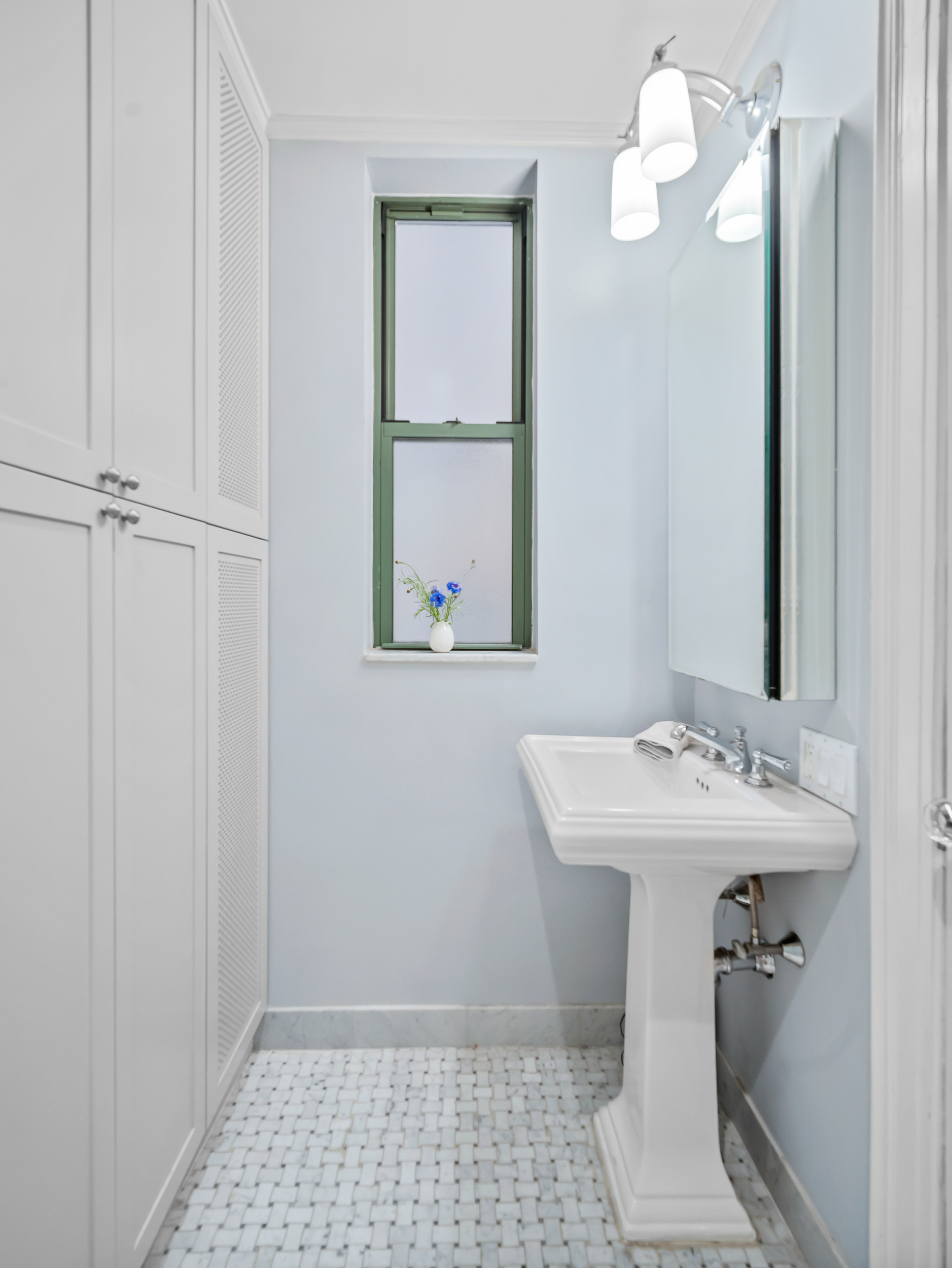595 West End Avenue, Unit 3C Manhattan, NY 10024 - Photo 7 of 9 a bathroom with a sink a toilet and mirror