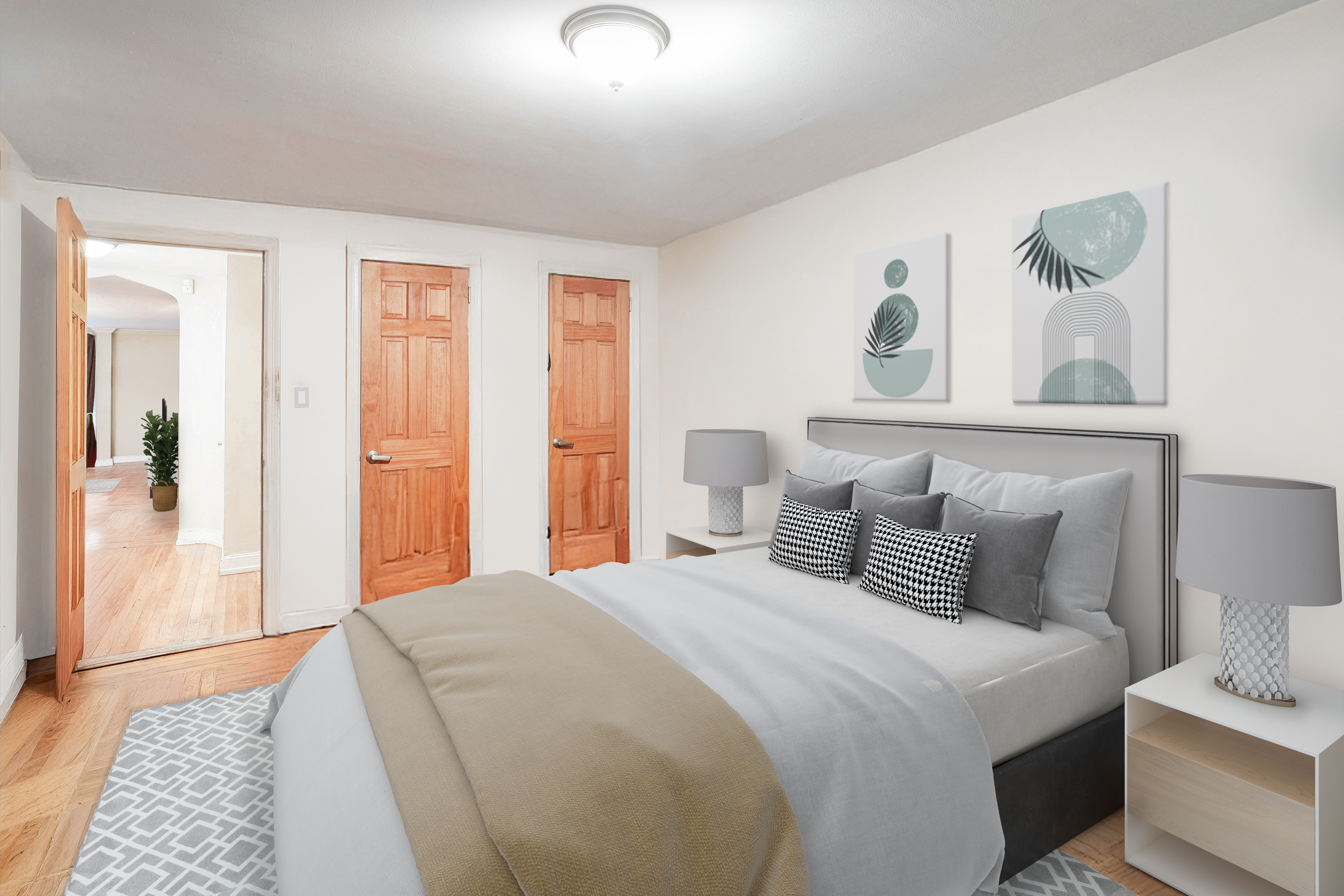 233 Battery Avenue Brooklyn, NY 11209 - Photo 20 of 26 a bedroom with a bed and a night stand