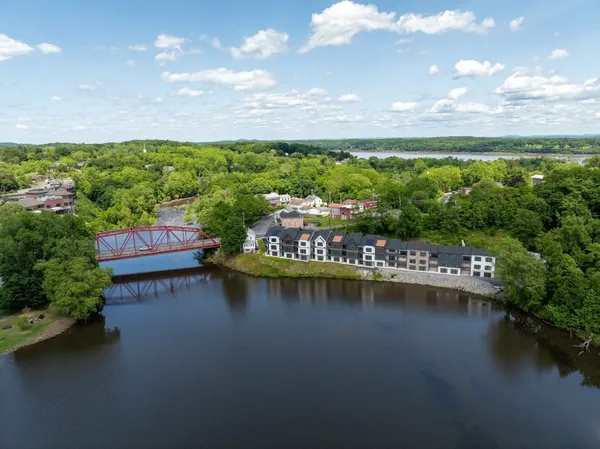 a view of a lake with houses in back