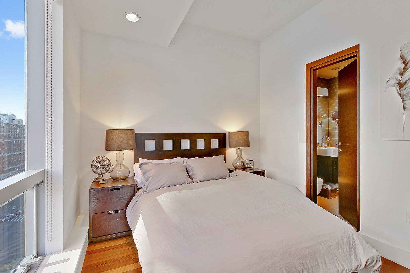 150 Myrtle Avenue, Unit 806 Brooklyn, NY 11201 - Photo 6 of 22 a bedroom with a bed and wooden floor