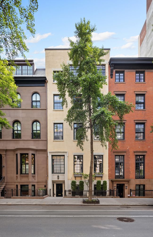 20 West 9th Street, Unit DUPLEX Manhattan, NY 10011 - Photo 9 of 10 a front view of a building with a garden