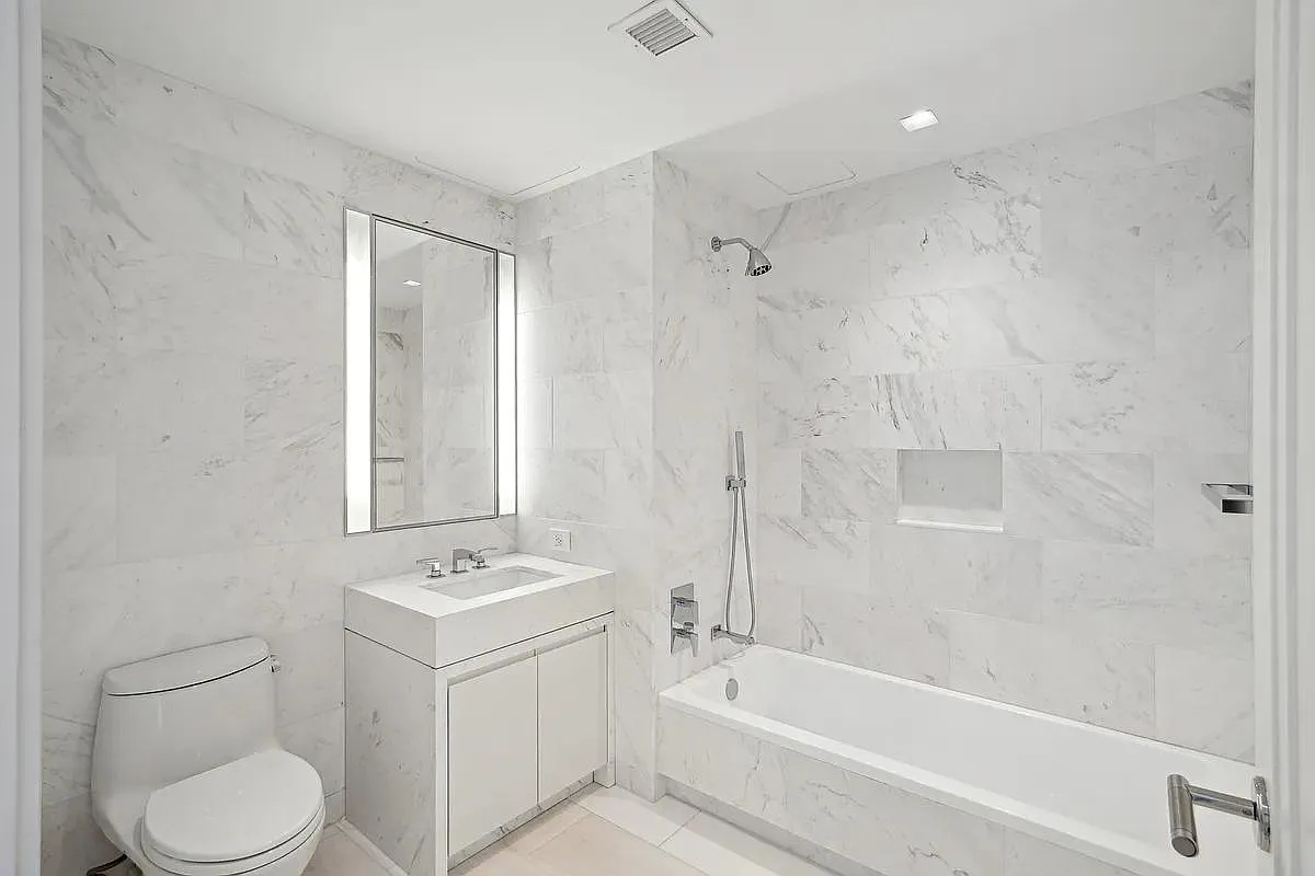 269 West 87th Street, Unit 9B Manhattan, NY 10024 - Photo 13 of 23 a bathroom with a sink toilet a vanity and bathtub